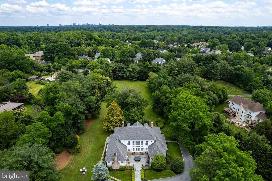 OPEN HOUSE CANCELLED.  Southern charm meets modern luxury in this grand estate.  Nestled on 2.9 serene acres behind a gated entry, this stunning 4-bedroom, 5.5-bath Antebellum-style manor offers timeless elegance and luxurious living in a peaceful, private setting.  A tree-lined drive leads to a double circular driveway and an inviting front porch with sweeping views—an ideal spot to welcome guests or enjoy a quiet morning.  Inside, refined details and custom craftsmanship define every space. The formal living room features dramatic walls of windows overlooking a beautiful courtyard, while the well appointed library is adorned with rich custom built-ins. Adding to the home's grandeur are the elegant music room and a formal dining room—perfect for hosting gatherings.

The heart of the home is a gourmet kitchen outfitted with high-end appliances, custom cabinetry, and charming banquette seating. The adjoining great room is anchored by a striking limestone fireplace and coffered ceilings that create a warm, inviting atmosphere.

Retreat to the luxurious main level primary suite with its private sitting room, spa-inspired bath, and architectural ceiling details. The upper level features a guest suite with beautifully renovated bath and two additional spacious bedrooms that share an updated buddy bath.  The lower level includes a spacious rec room and a separate in-law suite complete with its own entrance, kitchenette, and full bath—ideal for guests or multi-generational living.

A gracious lawn, mature landscaping, and a classic barn complete the estate, offering endless possibilities for outdoor enjoyment and entertaining.  If horses or a pool are in your future this home allows for both options!

Exceptional location is close to it all, but feels a world away. Minutes to Oakton Shopping Center with a Giant, CVS, Starbucks and restaurants. Excellent commuter location - 3 miles to the Vienna Orange Line Metro and convenient to major commuter routes - 66, 495 and the 267 Toll Road. Nearby community amenities include a playground, the library and Oakmont Rec Center with indoor pool, gym, mini-golf, a driving range and 9-hole golf course. Award winning school pyramid: Oakton Elementary, Thoreau Middle, Oakton HS.

This is more than a home—it's a lifestyle of elegance, privacy, and Southern hospitality.