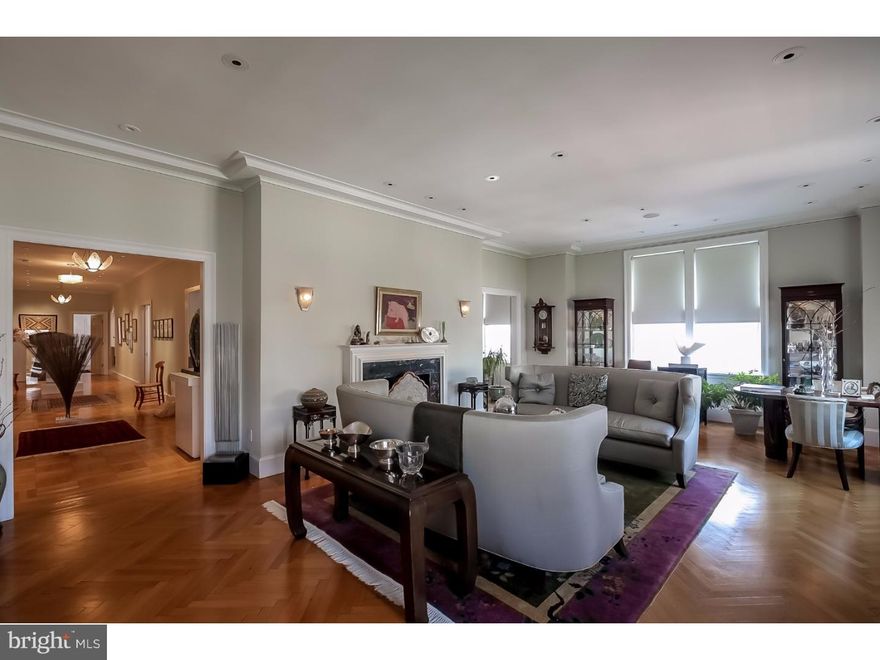 Located directly on Rittenhouse Square in The Barclay Condominium, this custom Wesley Wei designed luxury condominium residence blends modern updates with restored original details.  The expansive home features high ceilings, oversized windows offering Rittenhouse Square and dramatic panoramic sunset views, crown molding, original hardwood floors, and recessed lighting throughout.  The beautiful home includes a grand gallery foyer, separate dining room, living area with oversized windows, sitting area and library with a built-in bar and wine refrigerator, spacious guest bedroom overlooking Rittenhouse Square, updated hall bathrooms appointed in marble, and a spacious sun-filled Bulthaup chef's kitchen with oversized windows, custom cabinetry, stainless steel countertops and backsplash, luxury brand appliances including a built-in wood front Sub-Zero refrigerator with  pull-out freezer and refrigerated drawers, Gaggenau double oven and built-in steamer, two Miele dishwashers, and a massive center island with wraparound storage, a modern wood breakfast bar, Gaggenau 5 burner stovetop, and a stainless steel double sink.  An impressive master wing features a separate closet room fully appointed in luxurious Anigre hardwood and an extra large master bathroom features a rain shower, frameless glass doors, body shower, Mr. Steam unit, his and hers sinks, marble island with storage, and a large custom-built vanity.  A bright and open master bedroom includes custom shelving and built-in wall storage, oversized windows with expansive sunset views, and two separate sets of pocket doors that open to a private commode and a hot tub encased in marble.  There is a separate laundry room that includes access to the building's hallway, a stainless steel sink, and a side-by-side Maytag washer and dryer.