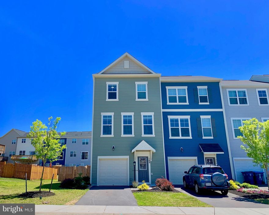 Beautiful,  move-in ready,  end  unit town home in spectacular Snowden Bridge. The home is well appointed with many upgrades including a fully fenced oversized yard and an expertly crafted deck for entertaining.  As you enter the home you will find top of the line, wide plank flooring that is crafted for durability and style. The first floor has sliding patio doors that exit out to the large back yard.  There is a large family or entertaining room that can easily double as a guest suite with a half bath. Up the stairs you will find a wonderful open floor plan with living dining and kitchen. The show stopper kitchen and cohesive flooring make this space perfect for entertaining. You can easily bring the entertainment outside on your deck! Beautiful granite counter tops flow across the tremendous counter space and on the over sized center island. The main level living space is straight out of a decorator's magazine with ultra stylish lighting, top of the line cabinetry and stainless steal appliances.  The home has plenty of natural light with huge  windows encompassing the living space. Upstairs you will find  three bedrooms and two full baths.  The well appointed master suite boasts a double vanity and  huge walk in closet .  There is a very conveniently located laundry on the bedroom level. If you are looking for a turn key charming home in a great location close  to shopping and much more this is the home for you.  The outstanding amenities of this community are unlike any other in Frederick County, VA.   Have the best of both worlds with the  low costs of living in Frederick County and a well planned development with wonderful pools, indoor tennis courts, athletic facilities, walking trails, dog park and much more!