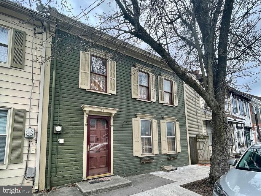 This historic home is full of charm and character!  1800+ sq ft, large rooms, high ceilings, wood floors, deep yard, off street paved parking, and tons of original features and built-ins are just some of the  highlights of this house.  Walk to shopping and restaurants in the beautiful downtown area. Take a step inside and enter the gorgeous foyer. The first floor features  a large formal dining room with access to the side porch, spacious living room with a brick fireplace, and large kitchen with an island, gas cooking, plenty of cabinet space and another door leading to the porch and back yard. There are 2 staircases to the second floor! Upstairs you will find 2 large bedrooms, each with access to the second floor porch,  a smaller, walk-through bedroom (currently being used as a large closet/dressing room) and another small room that could be an office, reading room, etc. The rear fenced yard with off-street parking complete this home. This home has a newer gas furnace and central air. Call today to make this your own private retreat!