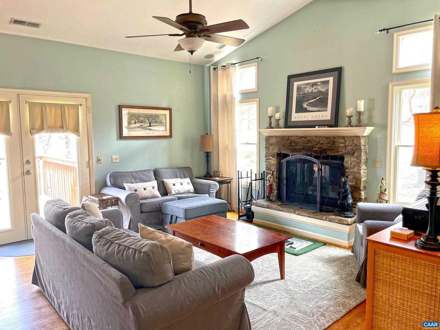 Beautiful mountain home, located at the end of a quiet street and with seasonal golf fairway views. Short path from the back yard takes you to the 17th fairway of Devils Knob Golf Course. Many beautiful ferns on this homesite will be your magical native and maintenance free landscape. 4 bedroom home with two master suites. The larger master is on the main floor. Open floor plan of the kitchen, living room and dining. Large kitchen with maple cabinets and granite counter tops. The stone, gas logs burning fireplace is the focal point in the living room. The ground level has a cozy den that is the perfect space for family TV time or games. All bedrooms, living room, dining and kitchen have hardwood flooring. Ceramic tile in the bathrooms. Home has two HVAC systems and the one for the top floor was replaced several years ago and now has a Eccobee thermostat that can be controlled remotely. Easy access to the house entry from the parking. Multi level decks, hot tub on the middle level. The home conveys furnished.,Granite Counter,Wood Cabinets,Fireplace in Living Room