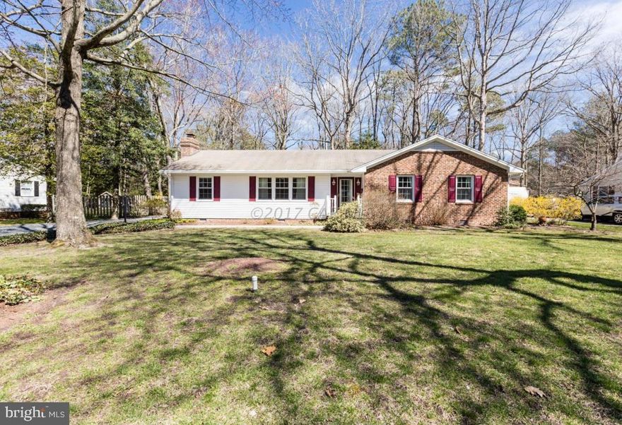 Nestled on a beautiful .46 acre lot, this well maintained 3 bedroom / 2 full bath rancher is filled with charm and special details.  Features include a welcoming foyer w/ parquet flooring and full view front door, living room w/ faux fireplace, family room w/ wood flooring and wood burning masonry fireplace, spacious kitchen w/ tile flooring, pantry w/ custom painted door and a separate dining area that includes built-in shelving and a window seat with storage below, a utility room w/ washer & dryer, 3 season sun porch w/ faux painted ceiling, paddle fan and backyard access, master bedroom w/ private bath, 2 additional bedrooms and a hall bath w/ single bowl vanity, tub/shower unit and linen closet. Seller is offering a 1 year AHS Shield Essential home warranty.