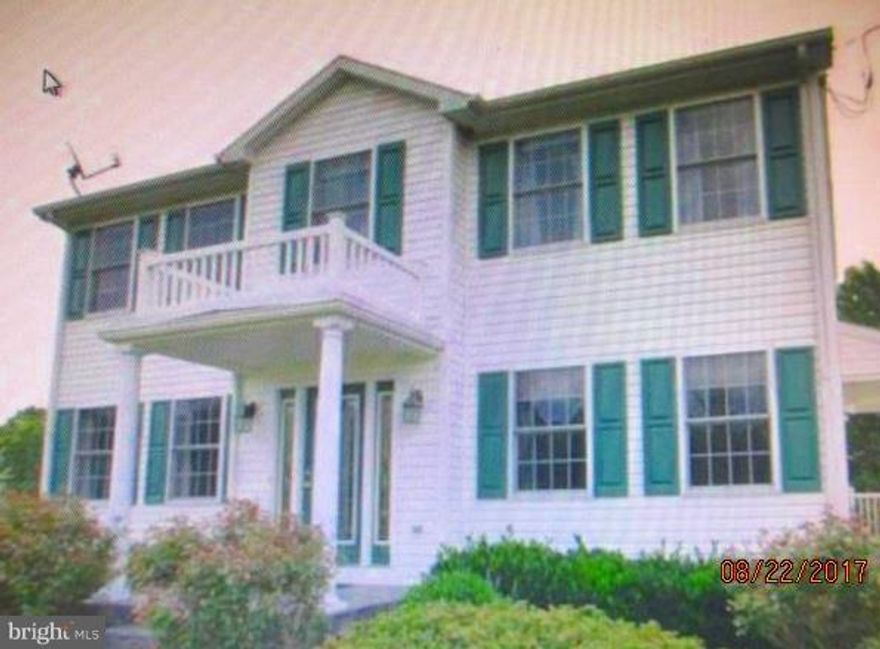 ONLY 1   miles over the WV state line! Well cared for colonial on 2 partially wooded acres. Hardwood throughout main floor. Expansive kitchen contains lots of cabinetry and opens to the family room, cook while you entertain! Living room sliding door exits to Trex deck overlooking the fenced in yard. Spacious bedrooms. Unfinished basement ready for your finishing touches! Walk out basement to patio