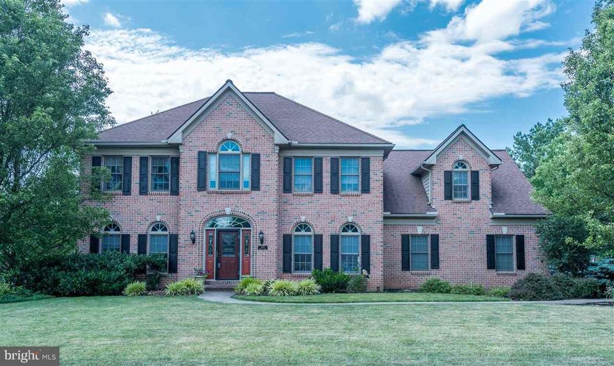 Custom Jeff Henry home for sale solid construction w/ brick front & hip roof design. 4 BR/2.5BA Lots of living & entertaining space! Site finished hdwd floors in foyer/DR/KIT Eat-In Kitchen has corian counters & double oven & opens up into a lrg Fam Rm w/ gas fireplace. Master BR has its own sitting area & office area plus full bath w/ deep soaker tub. 3 car garage. Lrg deck overlooks a tree-lined backyard. Unfinished walk-out bsmt- room to grow!