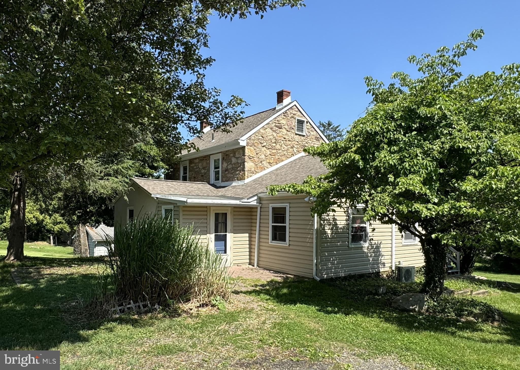 This 1895 farmhouse is divided into a duplex home but could be used as a single-family residence or potential in-law suite. The first door entrance on the left side closer to the garages has three upstairs bedrooms and a full bathroom, with access to the basement laundry area. The second door entrance is on the front porch (facing School Ln), and is all one floor with two bedrooms and a full bathroom. The basement laundry access is outside thru the door to the basement.  Parking for four or five cars available in the upper lot and room for at least 2 more cars in the lower secondary parking lot.  There are detached garages and a very large 39'x24' workshop with heat. This is a great location, with golf course views, close to Egypt Rd, Rt 363, Rt 202, and Rt 422, with easy access to King of Prussia, Valley Forge, and public transportation.
