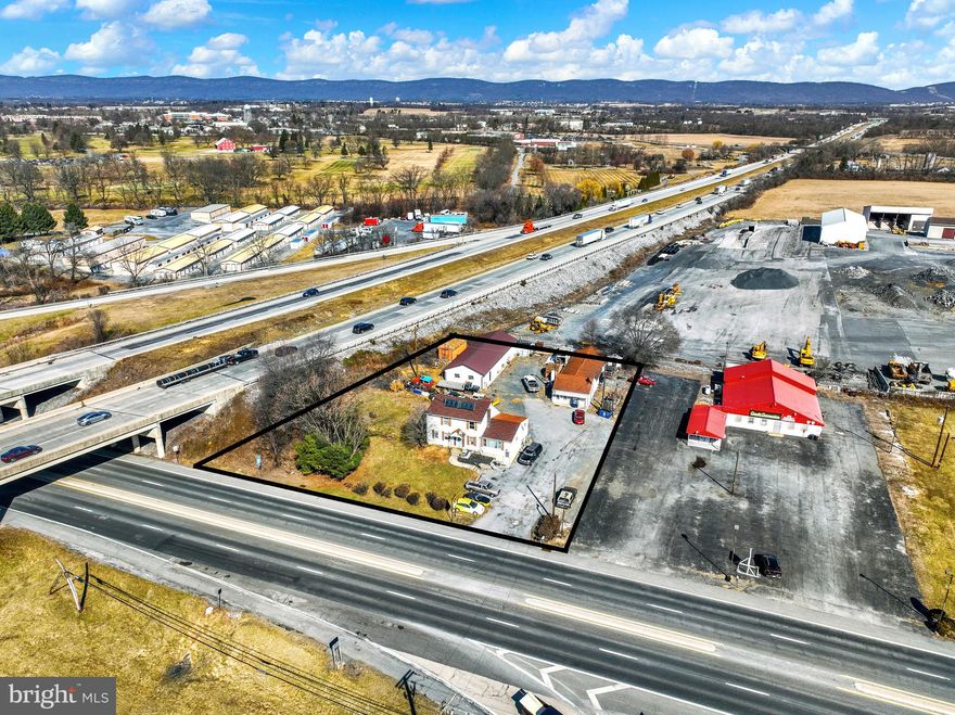 This 0.67-acre property offers incredible potential in a high-traffic location, boasting a 70,000 daily traffic count and Commercial Highway/Mixed-Use Residential zoning. With a blend of residential and commercial possibilities, this site provides flexibility for a variety of uses—whether you're seeking a redevelopment opportunity, an investment property, or a business location.

The property includes a newly built (2024) 2,500-square-foot 6 six bay garage, currently operating as an auto body repair shop, offering ample space for automotive services, storage, or other commercial applications. A 1,000-square-foot office space adds further business potential, while the five-bedroom, two-bath residential home could continue as a rental, or could be converted into office space.

Situated along W. Trindle Rd., just seconds from Interstate 81, this property provides exceptional visibility and accessibility to major commercial hubs. Whether you're an investor, business owner, or developer, this is a rare opportunity to secure a prime location in a growing market.

Being sold as-is. Contact us today for more details!