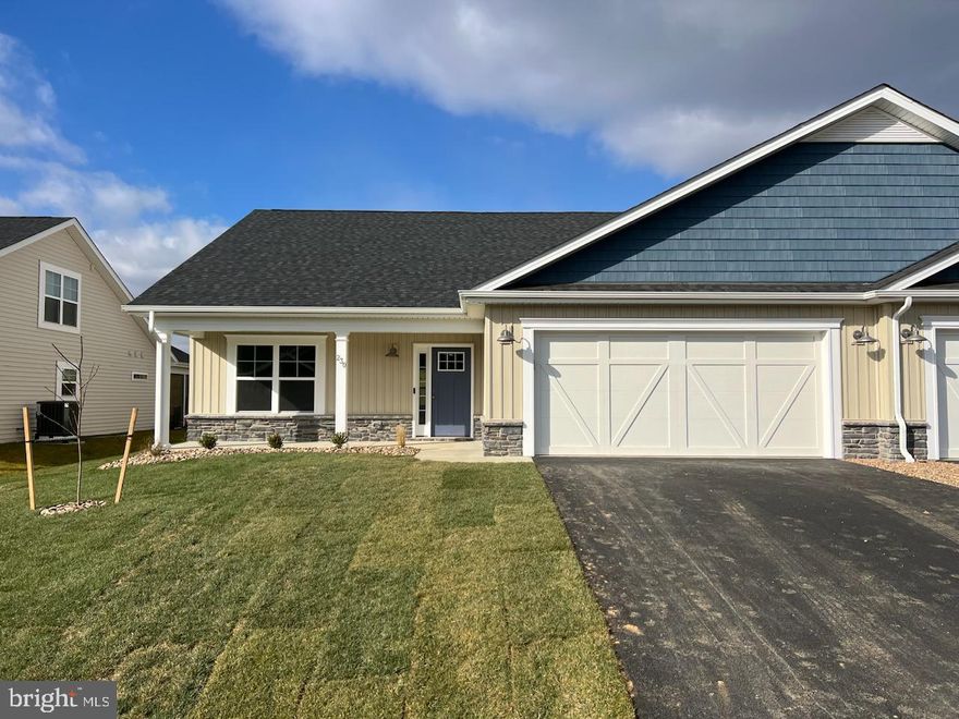 **SIMILAR PICTURES BUT THIS HOME HAS DIFFERENT COLORS INSIDE AND OUT **
ALMOST ready to move in!  This brand-new villa built by Panhandle Homes of Berkeley County has everything you need all on one floor.  Located near the Spring Mills area, Cardinal Pointe is convenient to I-81 for easy access to everything in Berkeley County plus MD/VA.  This home comes finished with an upgraded 12x12 covered rear porch, large covered front porch, 2 car garage with additional storage and a professionally sodded and landscaped low maintenance yard!  Plush carpet in the bedrooms and 100% Waterproof LVP Flooring throughout all the main living areas making cleaning a breeze.  Soft close cabinets and QUARTZ countertops in the kitchen and bathrooms! The owner's suite has a large step in shower, dual bowl vanity and comfort height commodes.  Common area and a berm behind this home gives you extra privacy.  Schedule your appointment to tour this home today!