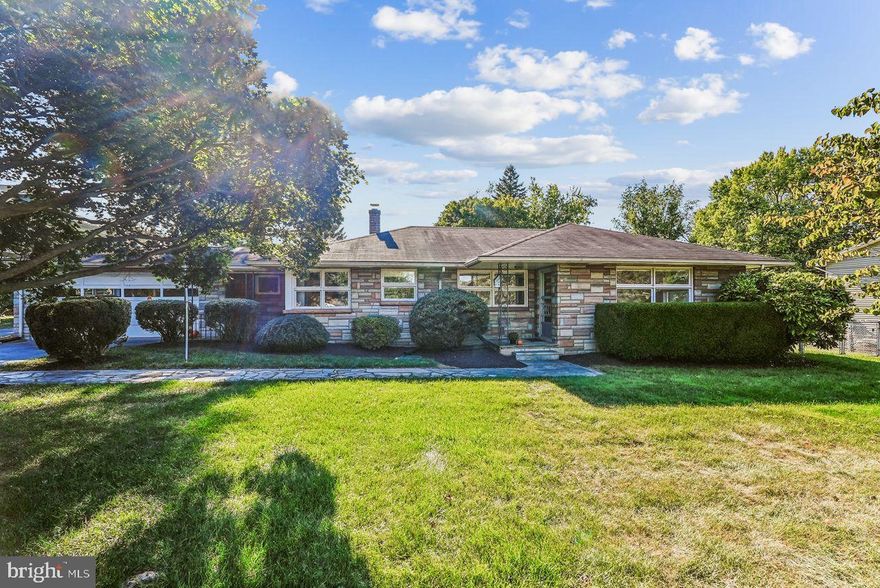 In-Town One Level Living Single Family Home with rare Mid-Century flair for under $650K! Perched on a premium almost one acre lot, with a 100% walkability score, sits this Mid Century Modern, all stone, custom built California Rancher. Rarely does a home of this caliber and character come to market. First time available in 70 years. Custom built in 1956 by the original owner, who was a master mechanic for decades at W. Loudoun's largest tractor dealership Whitmore and Arnold (now Browning Tractor). The house seamlessly blends its mid-century modern design into the mature landscaping snuggled around it. Main level living provides 1,800 sq ft with 3 light filled bedrooms with a refurbished full bathroom. All floors in main house have cozy radiant heat - feels so good on the feet! Spacious bright and inviting LR/DR combo off the kitchen. The kitchen features its own super convenient door inside the covered porch off of the driveway and attached 2-car garage, making unloading groceries a breeze. The eat in kitchen has plenty of natural light and comes with the original mid-century modern table and chairs. New stove with retro color lighted ceramic interior has the added convenience of a built in air-fryer. New built-in microwave above the new stove. Newer refrigerator too. Loads of cabinet space. Separate laundry room off of kitchen with plenty of space and built-in cabinets. Wait until you see the unique heated all-seasons enclosed Great Room with custom louvered windows. This custom all-seasons Great Room leads to a 2nd covered patio overlooking the bucolic fenced rear yard with a framed farmette-garden awaiting your touches. There is so much more...a separate She-Shed with electricity and a window. Also a 2nd oversized 2 car garage with an attached work shop! Plenty of room to expand or add a pool.
The covered patio off the all-seasons room is a great space for entertaining under the W Loudoun stars. This home's walkability score is off the charts! Walk to Purcellville schools, Firemans Field, restaurants, parades, festivals, shops and the W&OD hike bike horse trails. Also close to the jewel of the west--Franklin Park (fun family pool, sports fields, performance barn, frisbee golf, equestrian trails, fishing pond, pickle ball, tennis, and hockey courts). Close to Sleeters Lake for picnics, boating and fishing. Spend weekends at the numerous wineries and breweries. Excellent commuter, city, town and Dulles Airport access. Less than a mile to the bus stops, less than 5 miles to commuter parking lots, close to Rte 7, the Dulles Greenway and Dulles International Airport. Why not live in the vibe that is everything Western Loudoun? Secure this SFH and unparalleled quality of life before it's gone!