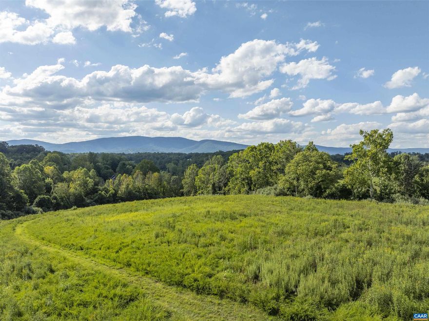 INCREDIBLE MOUNTAIN VIEWS!!! This exceptional 3 acre parcel offers a rare opportunity to build your dream home in the heart of Ivy. A new road winds up the ridge to this flat, elevated homesite where you can enjoy year round stunning 180 degree views of Calf Mountain just 15 minutes from downtown Charlottesville.