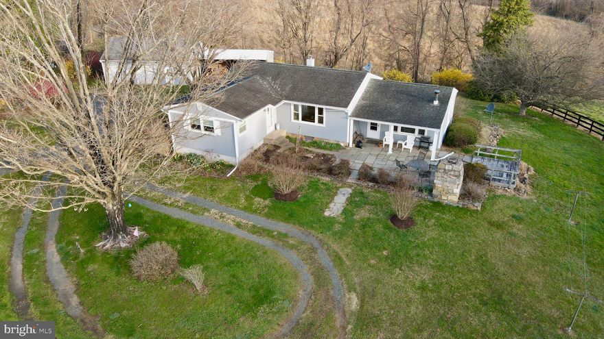 Price Reduction!!  Motivated seller. Bring your horses and animals!! Rare opportunity to own equestrian property without breaking the bank! This farmette embodies scenic natural beauty, peacefulness and serenity; it is a must see in person property to fully appreciate all it has to offer.  Your chance to own the best of rural Loudoun County while still being just minutes away from Purcellville and Leesburg's amenities and conveniences.  You can have it all!  Mutiple fenced pastures, water and electric inside the spacious barn with dedicated tack room, huge 2 car garage and separate workshop/storage areas are just a few of the highlights here.  3 bedrooms, large bright kitchen, original hardwood floors and loads of living space with incredible views highlight the inside.  The cozy wood burning stove will keep you warm and toasty on cold winter nights. The owners have even provided a stack of seasoned firewood to get you started.  The gardens will be blooming in all of their beauty and springtime glory just in time for new owners to enjoy.  Don't let this one slip away, it won't last long!!