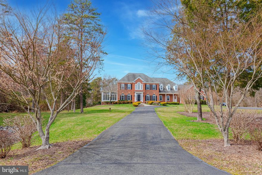 Look no further than this magnificent, fully renovated brick front NV Yorktown estate home on a phenomenal 5+ acre lot in Fairfax National Estates surrounded by trees for an abundance of privacy! No detail has been left unturned in the renovation of this immaculate home with over 7,320 square feet of pristine living space on three finished levels. Outstanding highlights of this home include hardwood floors throughout most of the main and upper levels; elegant moldings; soaring two-story Foyer; formal Dining Room; elegant Living Room with built-in bookshelf doors that swing open to showcase the hidden Solarium or Home Office; sunken Family Room with a wall of windows overlooking the backyard and a cozy gas fireplace; Gourmet Kitchen with island, quartz counters, stainless appliances, gas cooking, Breakfast Room with gas fireplace; sun drenched Morning Room with cathedral ceilings; Main level Home Office with French doors could also be used as a Guest Room; expansive maintenance free composite deck overlooks the phenomenal back yard - the perfect spaces to entertain your guests on the weekends, sip your morning coffee, or find peaceful retreat after a long day; Primary Suite on the upper level boasting a Sitting Room with gas fireplace, oversized walk-in-closet, and En Suite spa-inspired Bath with a soaking tub, glass enclosed shower, and dual sink vanity; Three additional Bedrooms all with private En Suite Bathrooms are located on the upper level; Lower level hosts a Rec Room/Game Room with wet bar, Media Room with projector and screen, In-Law Suite serviced by a full Bathroom, and several Bonus Rooms that could be used for wine storage/Home Gym/Play Room, plus an abundance of storage space. This outstanding property is ready to welcome YOU home!