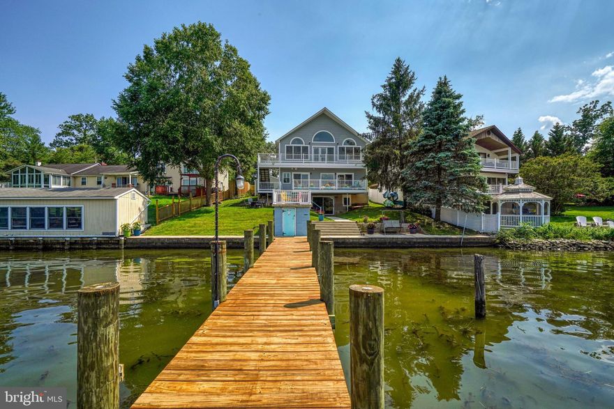 This Norman Creek custom-designed home has been recently renovated to meet the quality that suits your style. With a 90-foot dock, 15,000-lbs boat lift, 2-30amp shore power hookups, 5-foot low means, multiple decks, and extensive water views in a protected area you can’t go wrong. The interior flow is perfect for entertaining and enjoying the views from almost every room with 5 bedrooms and 4 baths ( main level and upper-level primary suites) plus a huge finished lower level that walks out to your front yard and dock. If you are the chef in the family the kitchen provides tons of cabinet space with a custom island, SS appliances, and under-cabinet receptacles leading into the dining room which can easily accommodate 10 guests. The living room offers the relaxing views you desire with a huge deck and a side staircase to the front yard. The upper level consists of a picturesque primary suite with a sitting area, walk-in cedar closet, spa-style bath, and large private deck. There are two other bedrooms and a full bath on this level plus a second laundry area in the hall. If serenity is what you are craving, then you don’t have to look any further.