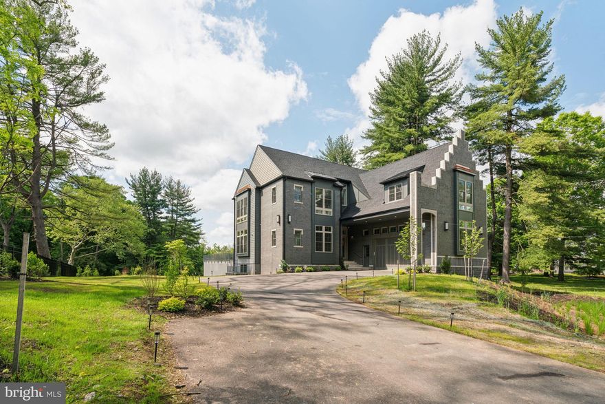 Welcome to 227 Northwestern Ave, this spectacular new construction home is situated on a quiet street neighboring Wissahickon Valley Park. The setting feels bucolic, located in highly sought-after Springfield Township. It offers a rare opportunity to own a very private estate with proximity to hiking and biking trails that athletes dream of while remaining minutes from Chestnut Hill and a 25 minute drive to downtown. The main floor with 11’ ceilings is flooded with natural sunlight and features a gourmet kitchen with oak cabinets, quartz countertops and backsplash, GE Monogram appliances, two sinks, open shelving and a walk-in pantry. The dining area and family room are designed with open concept living while architectural elements create an intimate sense of coziness. The living room is breathtaking with 22’ ceilings and a gas fireplace. Here also you will find expansive floor-to-ceiling windows framing endless views of trees. Step out onto the slate patio which is perfect for outdoor entertaining. The first floor is complete with an en-suite bedroom and convenient mudroom and a powder room. The second floor with 10’ ceilings features 4 en-suites all with floor-to-ceilings windows and walk-in closets with gorgeous tree top views. There is an ideally situated laundry room with GE Profile appliances and a well-equipped laundry station with top and base cabinets, quartz countertops and a sink. The primary suite is private with a large bedroom, sitting area and walk-in closet with custom cabinetry. The bathroom feels like a spa with double vanities, water closet, 67” free standing soaking tub and and a walk-in shower with dual rain shower faucets and body spray fixtures. The lower level with walk-out features another private en-suite and a separate wing with another full bathroom and offers plenty of opportunities as a home gym, play area and/or a home theatre. There is much more: 3-zone HVAC, Andersen windows, security system, hardwired speakers, multiple exterior cameras, gated entry with intercom and tray ceilings with light boxes throughout make for unparalleled, modern and well-lit space! This house is minutes from the restaurants and shopping in Chestnut Hill, Manayunk, Plymouth Meeting and Conshohocken. Close to the Morris Arboretum, Woodmere Art Museum, train station and several golf courses and country clubs. Easy commute to Center City, King Of Prussia, 76, 676, 476 and the PA Turnpike. Less than a 2-hour drive to NYC. 1-year builder warranty included. The property has a Phila zip code for postal purposes but is located in Springfield Township and Springfield School District.