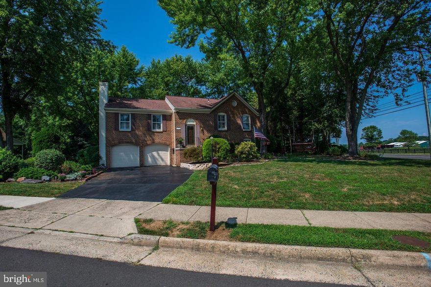 Well-maintained brick & siding home in lovely Borneham Wood. Over 2,200 total square feet & beautifully sited on 1/3 acre lot, complete with mature landscaping, rear deck, shaded patio area, tree swing and shed (with electricity). 5 true bedrooms, 3 full baths and loads of hardwood flooring throughout. Freshly painted with neutral palette. Two fireplaces (living room & family room) are ready for propane gas or wood-burning. Upper level features living, dining room & kitchen vaulted ceilings. Master bedroom includes dual closets, dressing area and full bath. Nicely sized secondary bedrooms have ample closet space. Lower level family room is perfectly sized for movie or game nights, with walk-out to huge screened three-season Florida/sunroom (with heater). A full bath is convenient for the 4th bedroom. 5th bedroom set up as an office but can convert back, depending upon your needs. Tucked behind the property is quick access to community common ground ... great place to walk the dog or play with the kids. Close proximity to Dulles Airport, shopping, schools, bus and metro rail.