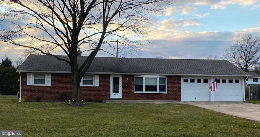 Nothing to do but unpack here! This neat as a pin 3-bedroom, 1.5 bath brick rancher is ready for its new owners!  Unwind in the living room with neutral paint, Berber carpet, ceiling fan and plenty of natural light from the large bow window.  The eat-in-kitchen features plenty of cabinetry, black appliances, double oven, portable island (on wheels), laminate flooring, backsplash, recessed lighting and a ceiling fan.  The kitchen has access to both the 2-car garage as well as to the large covered composite deck. The 3 bedrooms all have ample closet space & carpet (2 have ceiling fans).  The convenient hall bath has laminate floor and a nice size closet within. There is an additional closet in the hall way. A large clean, unfinished basement with a bonus half bath.  The current owner uses this room as a sewing /craft area.  There is shelving just waiting to be filled!  The attic and basement were both professionally weatherproofed. The driveway is big enough to park a few additional cars.  Come see for yourself! First time homebuyers? downsizing? This home is waiting for you!
