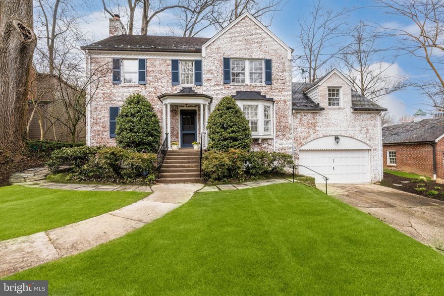 Welcome Home!  Brick colonial features charming rooms on the main level including a den with a window seat, office, half bath, living room with fireplace, foyer, dining room, and galley kitchen.  Freshly painted,  plenty of built-in cabinets and shelving, and new carpeting on the Lower Level.  The Upper Level features three bedrooms and two full baths (one room has an attached "bonus" room).  The top floor is finished and carpeted.  The Lower Level includes a recreation room with fireplace,  guest room, full bath, and laundry/utility room with walkout access and access to an attached two-car garage.  Lovely landscaping and patio with access from the kitchen and office.