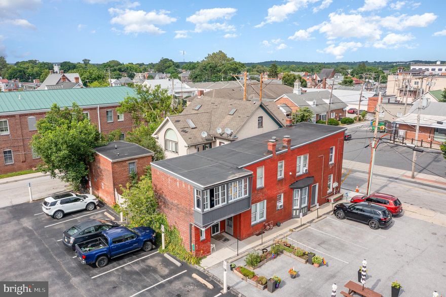 Photos just uploaded! Fully occupied, cash flowing 3 unit mixed use property (one of the only turn key rentals available for sale! Near Gettysburg College, lots of dining, shopping, tourism, and self storage centers (a tenant's dream!). Still close enough to commute to Hanover PA/ Carroll County MD (for tenant's employment etc). A fully leased 3-unit (mixed use) rental property in the heart of Downtown Gettysburg. Between the Town Square and Gettysburg College, with NO lawn to maintain, and upgrades throughout all units (especially as one tenant is Voucher, and this unit is maintained in compliance w/ the program). No leases have gone into Month to Month (all are currently within 1-3 year terms remaining). Notice: This building does not own its own parking lot; tenants and customers of the 1 commercial unit all currently parallel park or park in/near the Gettysburg Town Square. Parking option (lease); 1 tenant currently leases a spot from the adjoining Bank parking lot. This provides landlord with less snow removal/towing cost, or liability concerns (benefit to less land to maintain as an investment). 
1st floor rent roll: (1 commercial unit)/ window front; Hair salon $500/mo, 
1 bedroom/1bath Apt. currently at $1,025/mo, 
2nd floor Apt.: (2 bedroom/1 bathroom) $1,050/mo. 
Tenants responsible for water/sewer, trash, electric, gas.