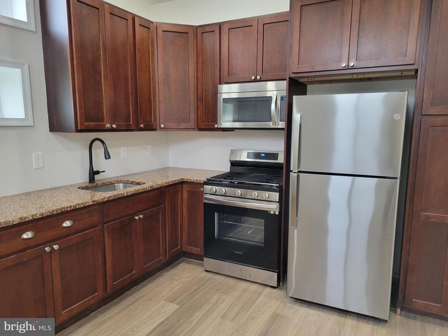 This is not a pet friendly property.  From central air to key pad entry, this newly renovated first-floor apartment in the heart of the North End boasts brand new features and a fantastic neighborhood.  

BRAND NEW EVERYTHING! Experience the luxury of a completely renovated space! From the flooring to the windows, kitchen,  and bathrooms –  ensuring a fresh and modern living environment. Be the first to live in this new home!

LUXURIOUS BATHROOMS:  Revel in the elegance of the full bathroom with a tub and shower surround adorned with marble flooring and a granite vanity. The half bathroom boasts new fixtures, and both bathrooms feature exhaust fans, vanity lights, and medicine cabinets with mirrors.

EFFICIENT COMFORT:  Enjoy the convenience of a high-efficiency central air conditioning and gas heating system, providing you with optimal comfort year-round.

LAUNDRY CONVENIENCE:  Has a laundry room with convenient laundry hookups. 

OUTDOOR SPACE:  Step outside to a fenced-in yard – perfect for relaxing or entertaining. Embrace the tranquility of a quiet neighborhood.

MODERN KITCHEN:  The kitchen is a chef's dream with all-new appliances, a brand-new gas stove with a griddle and plenty of cabinet storage. 

SPACIOUS AND STYLISH: This first-floor apartment features large closets in two bedrooms and a walk-in closet in the Primary bedroom. LED lighting in all closets and rooms which adds a touch of modern convenience, With 9-foot ceilings and an abundance of natural light, the space feels open, airy, and inviting to create an energy efficient atmosphere. 

PARKING:  Plenty of parking is available just outside the entry door for your convenience.

UPGRADES COMING:  The exterior of the building will be fully painted, and landscaping will be added in the spring, enhancing the overall appeal to the building. 

HANDS ON LANDLORDS: Enjoy the personal touch of small business owner landlords who are friendly, hands-on, and committed to ensuring a wonderful experience for their tenants.

 You enter the apartment from the rear of the property and directly into the apartment.  No steps!  You come directly into an amazing kitchen.  This kitchen is very large and has beautiful cabinetry,  plenty of storage,  granite countertops,  and new appliances .  There is more than enough room for an eat in kitchen.  The laundry Room is off the kitchen  and allows for more storage.  Neutral palette throughout this apartment.  From the kitchen, you go directly into the Living Room which is enormous.  Vinyl plank flooring throughout most of the home.  Such a beautiful room!  Off of the Living Room is half bath which is oversized.   Head back through the Living room and you will come to the first bedroom on your left.  This is a very nice sized bedroom, brand new carpeting, high ceilings and the closet is of a nice size.  Continue on to find the 2nd bedroom which also a good size, new carpeting and a lit closet as well.  The apartment continues to the Primary Bedroom which has vinyl plank flooring and a closet organizer ready for you to move your clothes into.  Also has a light.  This one is walk in.   The landlords did not spare any expenses in this unit and is so amazing, but best to see in person to get the full value of the space.  The unit also shares the common area lawn that is fenced in.  Since this building is on a corner, there is 3 sides of on street parking for plenty of cars. Basement is not included in this space and is for the landlord use only.  Landlord is looking for all applicants over 18 to have a credit score of 600 or more and have no criminal background. No smoking.