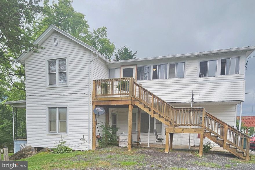 This 2 bedroom, one bath apartment you are going to love the spacious rooms15×17 sq ft kitchen has been recently updated, floor, counters, cabinets, & appliances, built in microwave,  full size stackable  washer & dryer!  13×14 living rm with carpet, hard wood floors in bedrooms, ceiling fans throughout  all rooms, newer 2 tier deck, a 25×6 enclosed porch, in a cozy country setting, but, minutes to downtown Romney  conveniences, tenant pays utilities