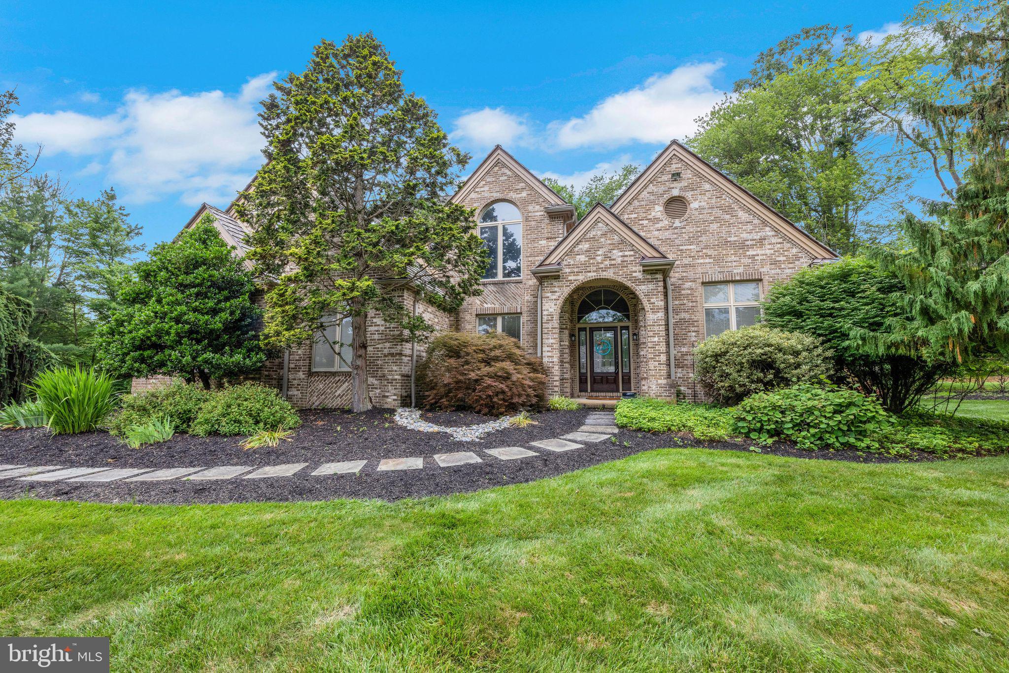 Welcome to 671 N Heilbron Drive, a refined retreat in one of Media’s premier neighborhoods. This elegant 4-bedroom, 4.5-bathroom estate sits on 1.22 beautifully landscaped acres in the coveted Rose Tree Media School District. Designed for both everyday comfort and upscale entertaining, the home features a gracious two-story foyer flanked by a formal dining room with built-in server and a private office with custom bookcases, connected to the living room via a wet bar. The living room, with its gas fireplace, opens to a stunning paver patio through double sliding doors.
The heart of the home is the light-filled, newly remodeled gourmet kitchen boasting quartz countertops, double ovens, a Monogram cooktop, farmhouse sink, and a spacious island with built-in microwave drawer. A bright breakfast nook overlooks the lush backyard and connects seamlessly to the family room, where a striking stone fireplace and sliding doors lead to a Trex deck with built-in grill and seating.
Upstairs, the luxurious primary suite offers a walk-in closet and a fully renovated spa-like bathroom. Two additional bedrooms enjoy en-suite baths, while the fourth includes a private sitting room. A second-floor laundry and walk-up attic access add convenience and storage, as well as potential additional living space..
The finished basement offers expansive entertaining space, cozy conversation areas, a potential guest suite adjacent to a full bath, and ample storage. Bilco doors provide egress to the backyard.
Additional highlights include a mudroom with built-ins, a 3-car garage, dual staircases, and a new dual-zone HVAC system (2023). All just minutes from Media’s dining, shopping, the airport, and Center City Philadelphia. Experience timeless elegance and modern luxury — schedule your private tour today.