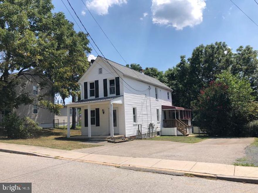 BACK ACTIVE! Renovated Cute 2 bedroom 1 1/2 bath. This might be the cutest house you will see! Beautiful hardwood flooring throughout both levels. Two upper bedrooms with full updated bath with custom ceramic tile. Upper level laundry area. Main living area with fireplace. LARGE new kitchen including granite and stainless steel appliances. Plenty of room for eat in area. Huge deck off rear kitchen area. Plenty of off street parking and fenced yard.