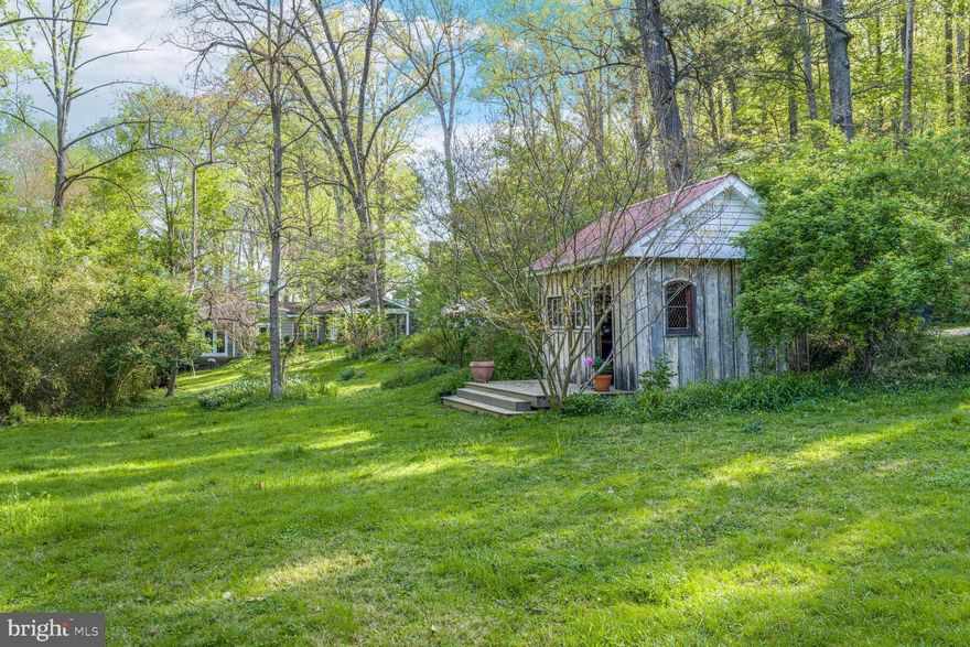 The rarest of properties, this enchanting one bedroom cottage is nature's gift.  Situated on 1 acre of wooded land, it adjoins the 13.5 acre White Horticultural Center owned by the Fairfax County Park Authority.  A small creek runs through the property. Above the creek is an abandoned tennis court, believed to be circa 1930's. The rebuilt barn is believed to have been built in the 1800's. The cottage has been updated, but it's original character has been thoughtfully preserved. The sale includes two lots (Tax ID's 0602 01 0017A and 0602 01 0018).