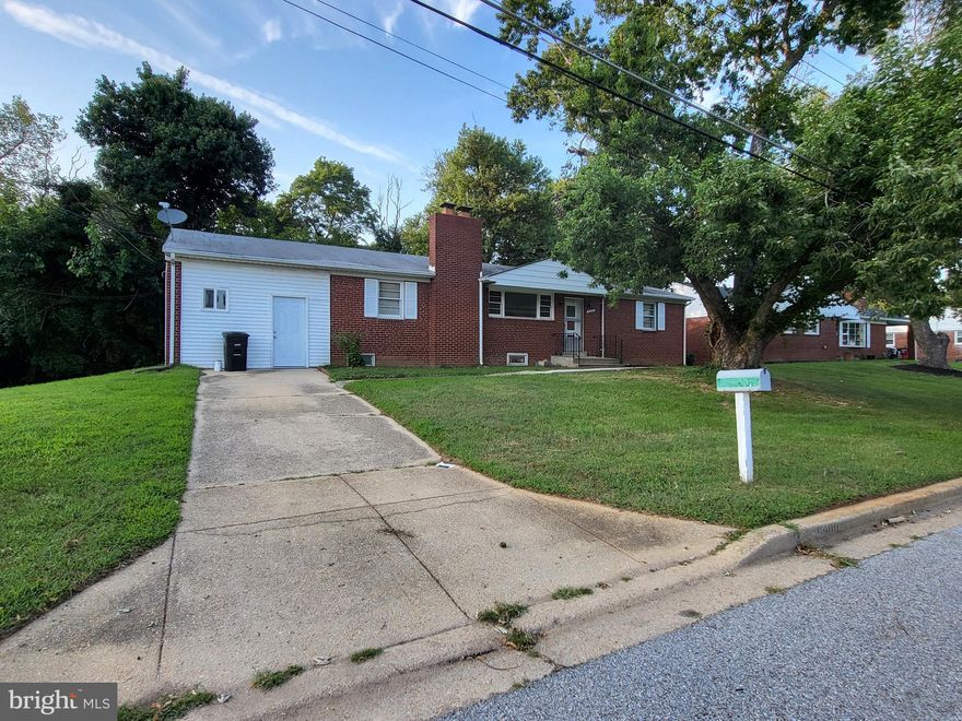 PRICE REDUCED  - Ready, ready. Spacious, Multi-generational home, CONVENIENTLY located in  CLINTON - a truly roomy 4-bedroom, 4-full bath home that's way more spacious than it looks from the outside with this corner lot,  there is extra parking with this solid brick home. You'll be pleasantly surprised by just how much this single family house offers! There is still opportunity for you to make it your own - Buy & Hold or Income Property.... So much potential.

The main level is super comfortable and great for entertaining. It has three good-sized bedrooms, offering plenty of private space, and two full bathrooms for everyone's convenience- one with a petite en suite. The kitchen has granite and updated/new appliances with room for a table, perfect for casual meals, and there's a separate dining room for more formal dinners. Plus, there's a versatile den that's perfect for a home office or a cozy library for reading/meditation. The living room with hardwood floors is a central spot to hang out, and that beautiful brick fireplace makes it extra cozy on chilly evenings.

Downstairs, you'll find an entirely self-contained living area that's incredibly flexible. This level has its own entry from upstairs and outside as well as its own kitchen with more granite and updated appliances including space for a table, great for independent living or extended family. There are also two more full bathrooms. You'll find a comfy bedroom and a large family room with another inviting brick fireplace – perfect for movie nights! A dedicated laundry room adds to the convenience. And don't forget the two "flex rooms" that you can use however you like – a home gym, craft room, media room, or extra storage!

Beyond all these awesome features, the lower level actually has the potential to bring in some extra cash. With its separate amenities, it could easily be an Accessory Dwelling Unit (ADU), giving you a valuable rental income or a private spot for multi-generational living.

And let's talk about the location – it truly lives up to the "CONVENIENT CLINTON" name. It's perfectly situated with excellent access to Joint Base Andrews, making it ideal for military personnel or frequent travelers. Commuting is a breeze with easy access to MD Route-5 and the Capital Beltway/I-95, connecting you seamlessly to the wider metro area. Book your appointment with Marie today!