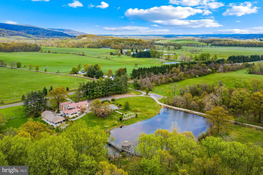 Welcome to the former Blackthorne Restaurant & Inn! Situated in a prime location, this 8,000 +/- square foot stone and stucco former residential improvement (c 1760s) built out as a restaurant and inn including 3 bar areas, commercial kitchen, 4 dining rooms, 8 stone wood-burning fireplaces, restrooms, and basement with a prep kitchen. Beside the main building, there is a large ballroom with restrooms and a prep kitchen. There are also multiple decks, gazebos, stone patios, stone walls, a pond, 2 story barn, and extensive graveled parking. Within the inn, the lodging improvements include a one suite room with 2 bedrooms, 2 full baths with a shared living room, and a dining room. Beyond the Inn, the lodging improvements include five standalone guest cottages each with 1 BR, 1 BA, and a kitchenette. The site is serviced by electricity, natural gas, telephone, cable. There is an on-site drain field for sanitary sewer disposal and two wells for water. Additional parcels for sale - contact listing agent.