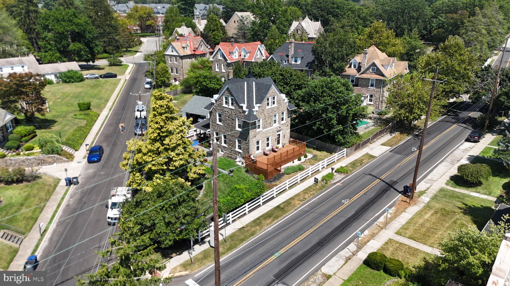 Timeless Elegance Meets Modern Comfort in the Heart of Ambler!
Welcome to this absolutely stunning 5-bedroom home, a masterful blend of old-world charm and modern upgrades—perfectly nestled in one of Ambler’s most coveted, walkable neighborhoods. Just steps from vibrant downtown dining, charming boutiques, a historic theater, and the train station, this meticulously maintained gem is truly a rare find!
From the moment you arrive, prepare to be swept off your feet by the enchanting curb appeal: a stamped concrete patio, wraparound front and side decks, lush professional landscaping, a tranquil koi pond, and a fully fenced yard that feels like your own private paradise. (Seller is willing to remove koi pond and landscape the area prior to closing).
Inside, every inch of this gracious home reflects thoughtful care and attention to detail. The dramatic front foyer welcomes you with soaring ceilings, exquisite period millwork, original hardwood floors, and incredible natural light. Through elegant pocket doors, step into a sun-drenched living room that flows seamlessly into the formal dining room and cozy family room, complete with custom built-ins.
The kitchen is a showstopper—boasting beamed ceilings, granite countertops, stainless steel appliances, a chic tile backsplash, painted cabinetry, and an island loaded with storage. A full bath and convenient laundry with access to the side deck round out the main floor.
Upstairs, the second level offers three spacious bedrooms (2 bedrooms have new closet doors) and a beautifully renovated full hall bath. The third floor is home to the dreamy primary suite with dramatic rooflines and an adjacent fifth bedroom—perfect as a nursery, office, or reading retreat with built-in window seating and extra storage. Home is priced to give new owners the ability to add a bath on the third level.
The expansive, unfinished basement opens the door to endless possibilities—home gym, media room, play space—and includes a private entrance, oversized attached shed, and abundant storage.
Major upgrades include: updated plumbing and HVAC, newer windows and custom blinds, upgraded electrical panel to support a 3500-watt generator which is included, garage, top roof (w/55 yr transferable warranty) and lower-level roofing with gutters, exterior pointing, and more.
Topped off with a detached two-car garage, award-winning Upper Dublin schools, and unbeatable access to major routes and public transit—this spectacular home is the dream home you’ve been waiting for.
Don’t miss your chance to own a piece of history with all the comforts of today—schedule your tour now! Sellers offering a one-year home warranty at closing.