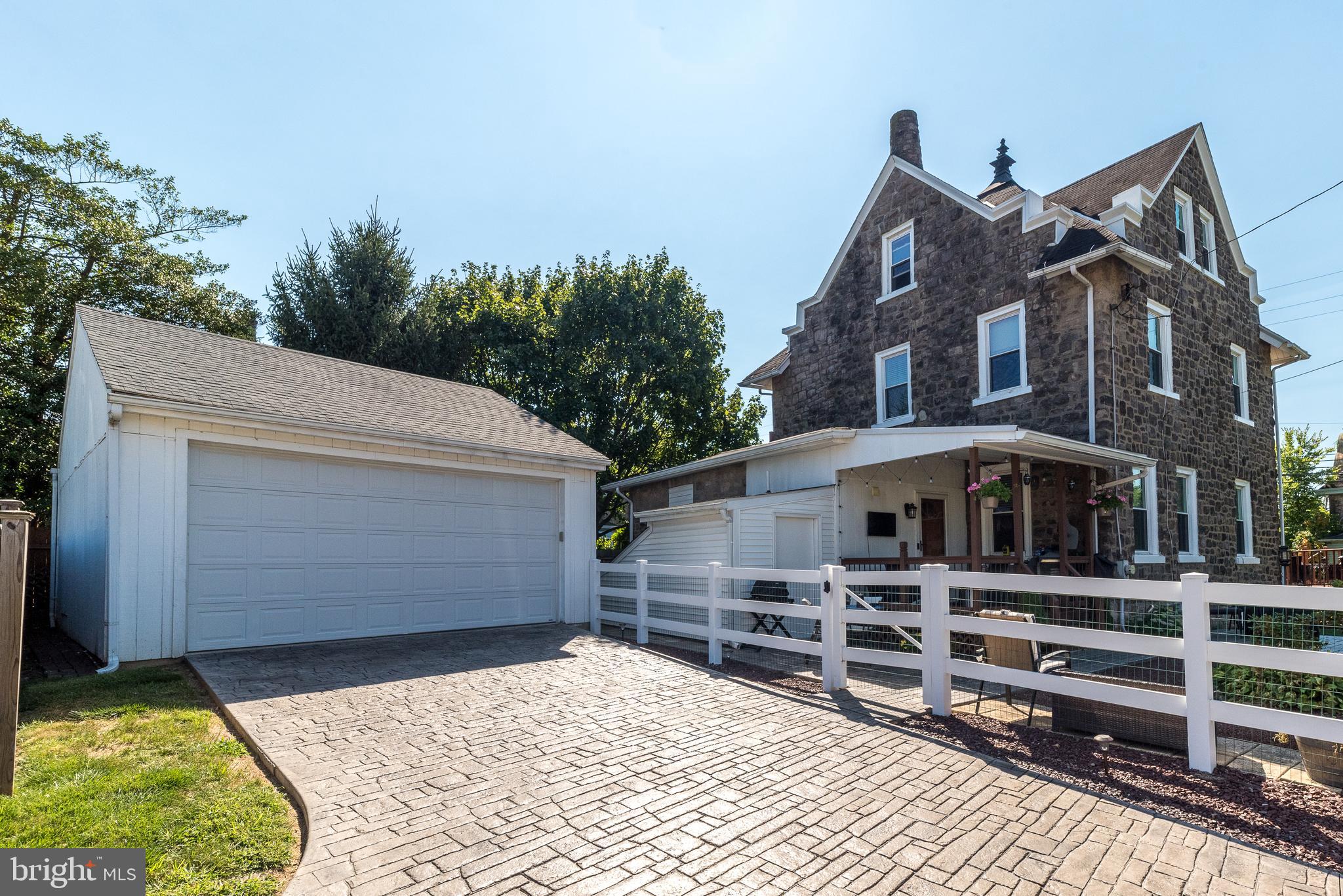 Timeless Elegance Meets Modern Comfort in the Heart of Ambler!
Welcome to this absolutely stunning 5-bedroom home, a masterful blend of old-world charm and modern upgrades—perfectly nestled in one of Ambler’s most coveted, walkable neighborhoods. Just steps from vibrant downtown dining, charming boutiques, a historic theater, and the train station, this meticulously maintained gem is truly a rare find!
From the moment you arrive, prepare to be swept off your feet by the enchanting curb appeal: a stamped concrete patio, wraparound front and side decks, lush professional landscaping, a tranquil koi pond, and a fully fenced yard that feels like your own private paradise.
Inside, every inch of this gracious home reflects thoughtful care and attention to detail. The dramatic front foyer welcomes you with soaring ceilings, exquisite period millwork, original hardwood floors, and incredible natural light. Through elegant pocket doors, step into a sun-drenched living room that flows seamlessly into the formal dining room and cozy family room, complete with custom built-ins.
The kitchen is a showstopper—boasting beamed ceilings, granite countertops, stainless steel appliances, a chic tile backsplash, painted cabinetry, and an island loaded with storage. A full bath and convenient laundry with access to the side deck round out the main floor.
Upstairs, the second level offers three spacious bedrooms (2 bedrooms have new closet doors) and a beautifully renovated full hall bath. The third floor is home to the dreamy primary suite with dramatic rooflines and an adjacent fifth bedroom—perfect as a nursery, office, or reading retreat with built-in window seating and extra storage. Home is priced to give new owners the ability to add a bath on the third level.
The expansive, unfinished basement opens the door to endless possibilities—home gym, media room, play space—and includes a private entrance, oversized attached shed, and abundant storage.
Major upgrades include: updated plumbing and HVAC, newer windows and custom blinds, upgraded electrical panel to support a 3500-watt generator, garage, top roof (w/55 yr transferable warranty) and lower-level roofing with gutters, exterior pointing, and more.
Topped off with a detached two-car garage, award-winning Upper Dublin schools, and unbeatable access to major routes and public transit—this spectacular home is the dream home you’ve been waiting for.
Don’t miss your chance to own a piece of history with all the comforts of today—schedule your tour now!