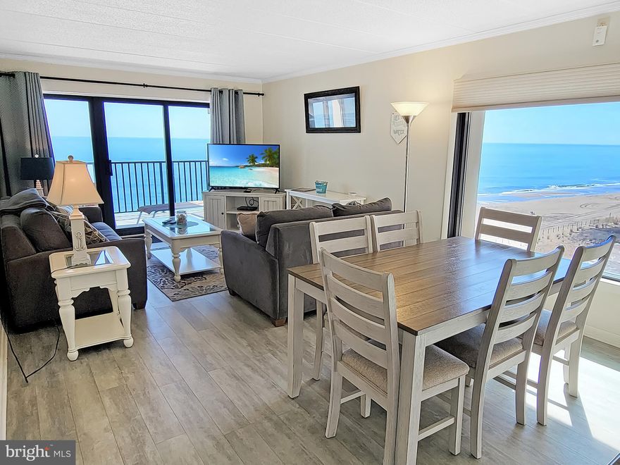 OCEANFRONT, corner/end unit 3 bedroom, 2 bathroom condo 100th. St. in Marigot Beach! Fantastic ocean and beach views await the new owner of this condo. Enjoy the oceanfront balcony from the living room and the main bedroom. This end unit comes fully furnished and offers spectacular views directly east and south. You'll also love the private entry balcony not only on the oceanside, but also on the bayside - the best of both worlds. Enjoy the oceanfront sunrise in the morning and the bayside sunset in the evening, all while never leaving your condo! This condo has several updates including new HVAC (2024), plank flooring in the living and bedroom areas and granite countertops in the kitchen. Marigot Beach offers easy, direct beach access and an indoor pool. You'll also have 2 assigned parking spaces and  be close to shopping (Gold Coast Mall is right across the street,) restaurants, etc. You don't want to miss out on this one!