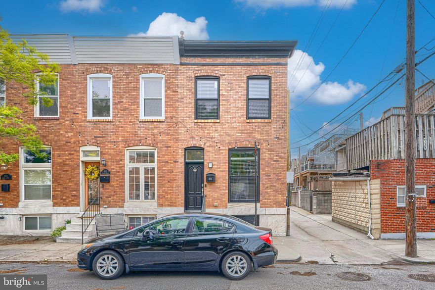 Nestled in the charming Brewers Hill Historic District, this exquisite end-of-row townhouse, beautifully renovated in 2016, stands out with its bright, airy feel and clean, elegant design. Bathed in natural light from oversized windows on multiple exposures, this home offers 2,464 square feet of thoughtfully finished living space that balances style, function, and everyday comfort.

Step inside to discover a warm and inviting interior featuring stunning hardwood floors that flow seamlessly throughout the main living areas. The gourmet kitchen is a chef's dream, equipped with stainless steel appliances, upgraded countertops, and ample space for culinary creativity. Enjoy casual meals in the cozy breakfast area or host dinner parties in the elegant dining area.

The spacious living room is anchored by a sleek ethelene fireplace and serves as the heart of the home, a perfect setting for relaxation or entertaining guests.  A standout feature on the entry level is the oversized mudroom - large enough to function as a flexible bonus space, a home office, or additional bedroom setup.

With four generously sized bedrooms and three and a half bathrooms, there's plenty of room for everyone to unwind. The primary suite boasts a luxurious en-suite bath with a digitally temperature-controlled 12 head spa fixture, ensuring a private retreat at the end of the day. The fully finished basement adds valuable living space, perfect for a private home office, gym, or guest suite, while the convenient laundry area makes chores a breeze. Thoughtful details, such as double-pane windows and modern fixtures, enhance the home's energy efficiency and comfort.

Outside, the property is adorned with exterior lighting and well-maintained sidewalks, creating a welcoming atmosphere.  A private rooftop deck offers panoramic city views and the perfect view of the Natty Boh sign. Outside, enjoy the rare convenience of covered private parking with a Level 2 EV charger. 

Located just a 10-minute walk from Canton Waterfront Park, the home offers easy access to scenic waterfront paths and outdoor recreation. Across the street, the Volo Sports Club provides a vibrant hub for social and athletic activity. Everyday essentials are minutes away at Canton Crossing, featuring Harris Teeter, Target, and popular dining options like Gunther & Co, Iron Rooster and Mission BBQ. Brewers Hill is not just a location; it's a lifestyle. This historic district is known for its rich heritage and community spirit, with tree-lined streets and a friendly ambiance. 

This home is more than just a place to live; it's an opportunity to embrace a vibrant community and a lifestyle filled with charm and convenience. Don't miss your chance to make this stunning property your own!