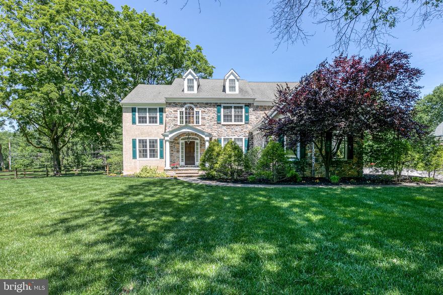 Stunning stone and stucco Farley Home gem, impeccably designed by Peter Batchelor, in a coveted, established Bryn Mawr community. Set on .83 lush acres in a family-friendly neighborhood, with lovely landscaping, a Belgian block-lined drive, 3-car attached garage, inviting covered front entry, and expansive level fenced backyard heightening the appeal. This 4-bedroom, 3.2-bath beauty s generous living space begins with a gracious 2-story light-filled foyer accentuated by a magnificent chandelier, gleaming hardwood floors, and a turned staircase rising to an upper landing. Off the airy entrance hall sits a coat closet, powder room, and handsome wainscoted office/den for working peacefully at home. Wide openings sweep you into large formal living and dining rooms brightened by oversized windows and adorned with tasteful millwork, affording an effortless flow for entertaining. Connected to the dining room is the true heart of the home, a spacious modern open kitchen, breakfast and family room, drenched in natural light, and the perfect setting for congregating with guests and loved ones. Gorgeous wood cabinetry, extensive dark granite countertops, top-of-the-line stainless steel appliances, and a center island with seating and plentiful storage afford every bell and whistle a gourmet chef could want. Enjoy morning coffee and casual fare in the sunny breakfast area, or step through glass-paneled French doors to the wonderful rear patio and yard for the ultimate outdoor pleasure. Adjoining the breakfast room, a dramatic vaulted family room with two tiers of windows, a floor-to-ceiling stone fireplace and ceiling fan provides a great place to relax. On the upper level, an open landing proceeds to the sleeping quarters. Retire to your capacious carpeted master bedroom with a striking recessed ceiling, complemented by a separate sitting room, big walk-in closet with custom built-ins, and tiled spa bath with a jetted tub, oversized glass-enclosed shower, double-sink vanity and private toilet room. Three more carpeted bedrooms are comfortable and well-proportioned, one with an en-suite bath. A third full bath and laundry room round out the second floor. Other highlights are a fully-finished day-lit lower level with high ceilings, huge rec space and a half bath, newer paint throughout the house, central AC, central vacuum, and a security system. All this luxury is enhanced by a prime Main Line location near top-rated Radnor schools and a wealth of local conveniences.