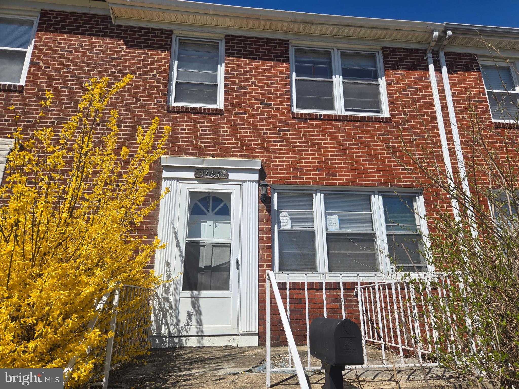 Spacious three bedroom all brick townhome in convenient location. Open main level floor plan with hardwood flooring. The home features a huge covered rear porch and a large open front porch. Plenty of street parking and great access via the rear alley. Unfinished basement is ready for your imagination.