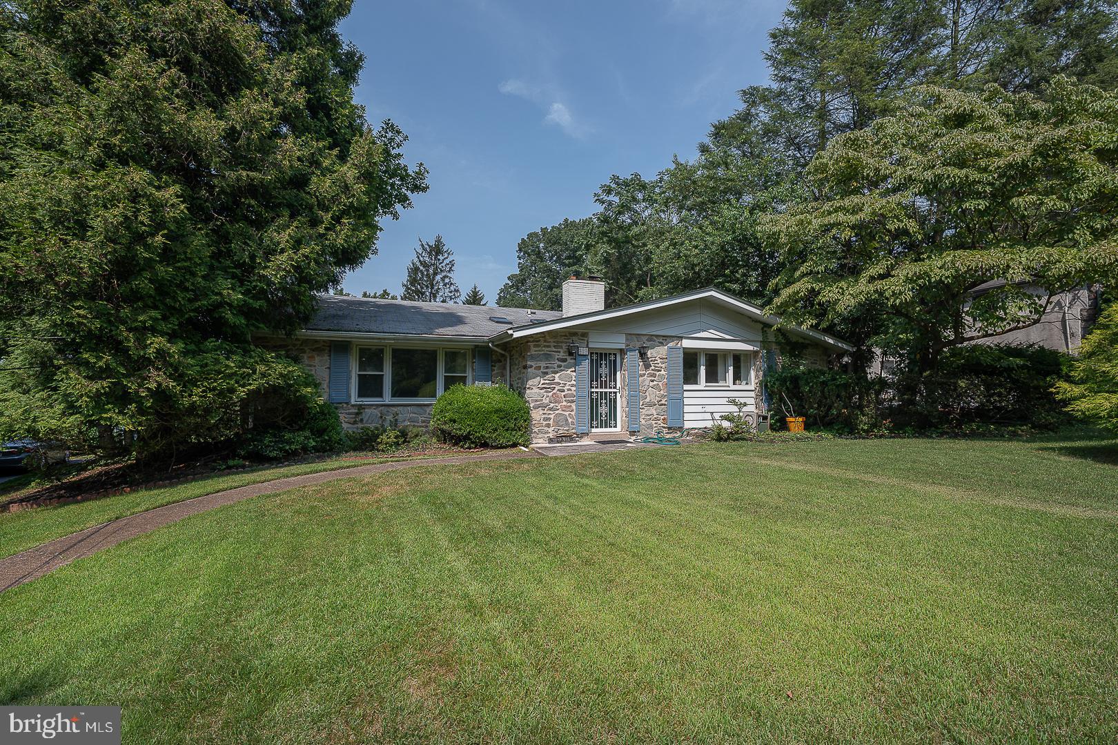 Welcome to 323 Hidden River Road in desirable Penn Valley – a spacious and beautifully maintained 5-bedroom, 3.5-bathroom home nestled on a private 1.23-acre lot in the award-winning Lower Merion School District. With over 4,100 sq ft of living space, this home offers the perfect blend of comfort, style, and function. A foyer with skylights warmly greets you upon entry, leading into a bright formal living room featuring soaring vaulted ceilings. A striking stone fireplace anchors the elegant formal dining room and connects seamlessly to the eat-in kitchen, complete with a breakfast area and convenient access to the back deck. Upstairs, the expansive primary suite includes two closets and a full ensuite bath. Three additional bedrooms and a full hall bath with double vanity and tub complete the upper level. Down a few steps adds incredible flexibility with a spacious family room with fireplace, two bonus rooms ideal for a 5th bedroom, home office, or gym, plus a full bathroom, half bathroom, mudroom with laundry and outside access, and abundant storage throughout. Step outside to a large back deck overlooking the level backyard – perfect for entertaining, play, or simply enjoying the natural surroundings. Ideally located near major roadways for an easy commute to Center City, and just minutes from shopping, dining, and recreation.
Don’t miss this exceptional opportunity to own a move-in-ready home in one of the Main Line’s most sought-after neighborhoods!