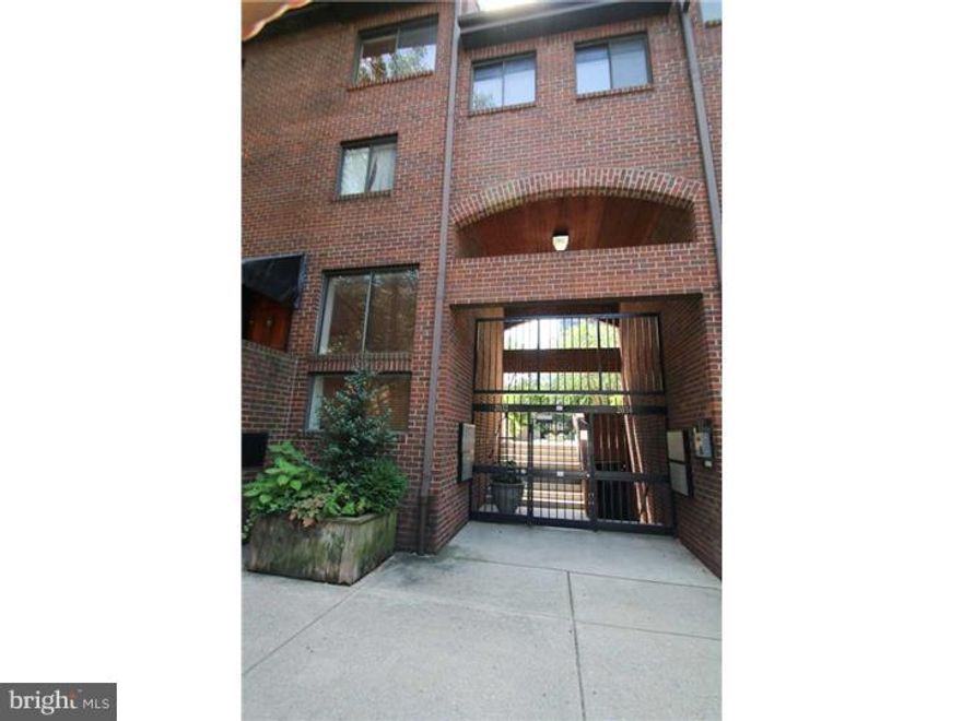 Spacious 2bed/2.5 bath, bi-level condo in gated, landscaped courtyard with GARAGE PARKING on tree-lined block in Logan Square.   Life at Walden Walk is convenient and ultra-safe: just park in your private garage parking space and walk home through a secure, beautifully landscaped courtyard. Main floor features: custom foyer; exquisite powder room; eat-in kitchen with beautiful wood cabinetry, high-end counters, and mosaic tile backsplash; open dining area; expansive sunken living room with fireplace, high windows, and sliding glass doors leading to lovely private patio perfect for grilling or entertaining. Second level offers large master bedroom with walk-in closets and modern bathroom; second bedroom with ensuite bath; and laundry room. This home features custom paint and finishes throughout, tons of closet space, auxiliary heating system, private deeded parking space and 9 x 12 secured storage room in garage.  Located in the Greenfield school catchment and walking distance to Trader Joe's, Whole Foods, Schuylkill River Running Trail, Philadelphia Museum of Art, Barnes Museum, Rittenhouse Square, and all of Philadelphia's best boutiques restaurants bars and nightlife!