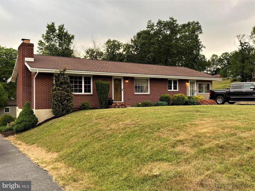 Impressive!!!  This 4 bedroom, 2 bath, brick rancher has so much to offer.  This home features a stone fireplace in the living room, which is great for reading a book by the fire.   The kitchen has lots of shelving in the adjacent pantry, granite counters in the kitchen, oak cabinets and ceramic tile flooring. The dining area also has oak built-ins with matching granite counter and ceramic tile flooring.  The ceramic tile flows into the foyer.  The living room has gleaming hardwood floors and a large picture window.  This home has ample storage space, spacious rooms and two outdoor spaces, great for entertaining.  Both bathrooms, the kitchen, basement and first floor family room have been renovated. The basement offers additional living space with a family room, the fourth bedroom and second bath.  There is also a lot of parking, with two separate driveways.   This home is conveniently located close to the West Virginia state line and major employers.  Call Today to Schedule a Tour!!!