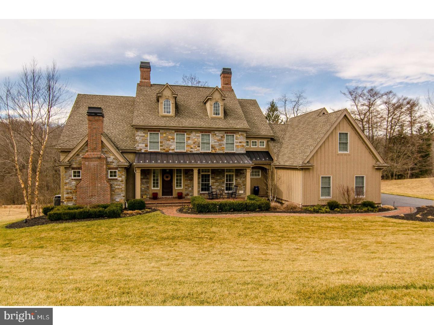 Better than new and practically perfect describes this beautiful custom-built home. The best lot was chosen for this 4-5 bedroom, 6 1/2 bath Burrows Ridge masterpiece set amidst 43 acres of natural and preserved land. Travertine tile and site-finished oak floors, along with extensive millwork, extend throughout the entire first and second floor. Just off the foyer is an intimate study with built-ins and a gas fireplace. The dining room features impressive wainscoting and offers seating enough for large gatherings. The wall of windows in the great room and kitchen frames the view of the beautiful preserved land at the end of the property. The chef's kitchen will delight both the cook and guests with expansive granite countertops, maple cabinets, Wolf six-burner gas stove, built-in microwave, two convection ovens, Sub-Zero refrigerator, farmhouse porcelain sink, two Asko dishwashers, prep sink, tile backsplash and gas fireplace. French doors open to the patio with a gas fireplace and pergola perfect for entertaining any time of the day or night. The first floor owner's suite features radiant floor heat in the bath, double shower, jetted tub and separate vanities. Upstairs you'll find a loft room perfect for an au pair or in-law suite with its own full bath and laundry hook up. In addition there are 3 more bedrooms, each with its own full tiled bath and custom plantation shutters. Extraordinary features continue on the walkout lower level, which has been designed to maximize entertainment space both inside and out. In addition to the large family room, there is a second kitchen with a SubZero refrigerator, media room, fitness room, study/office, full tile bath, and French doors to the bluestone patio, heated saltwater pool and hot tub. A centrally-controlled lighting system, security system, three-zone heating and cooling, and extensive landscaping with accent lighting complete the luxury and elegance you will find in this home.