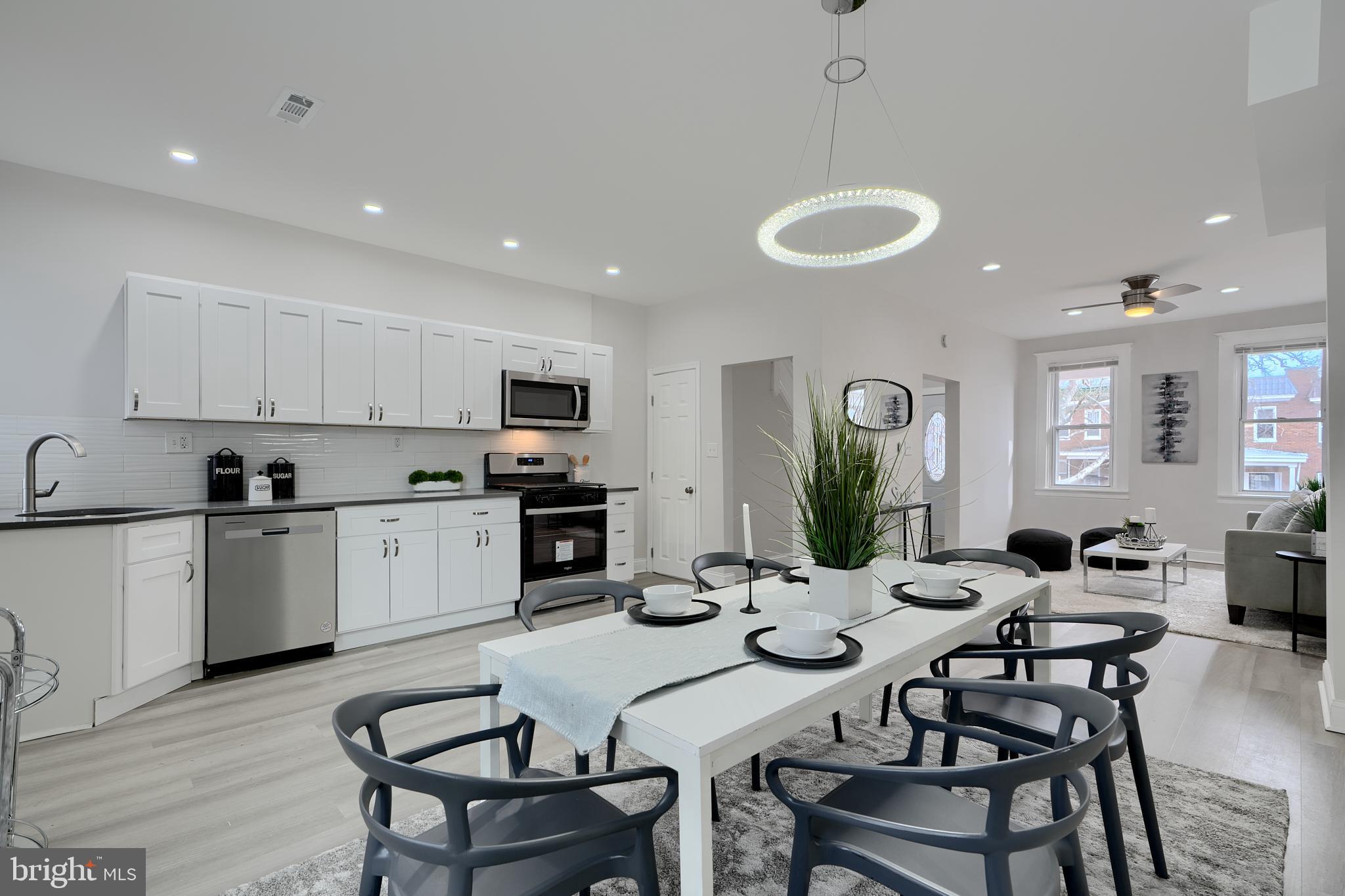 Beautifully Renovated! Open Layout! All new Kitchen with Stainless Appliances, Quartz Countertop, Coordinating Tile Backsplash, Wood Shaker Cabinets, Upstairs Bathroom features Custom Tilework, Designer Fixtures, and Designer Lighting. Basement Suite includes Family Room, Bedroom and Private Full Bathroom with Custom Tilework and Designer Fixtures. New Flooring and Carpet, 2 Porches, New HVAC, Cool Modern Lighting. New! Parking in rear! You will Love this Well lit, Happy Home!   Also see our other Model on this block, 4004 Fairfax.