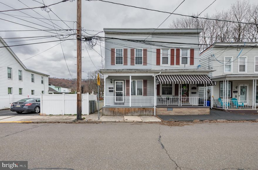 Move-in ready twin awaits! Nothing to do here but unpack the moving truck and fire up the BBQ! Quaint front porch leads to open LR/DR with solid surface floors. Kitchen is large and spacious with plenty of cabinetry, and a rear exit to an oversized & covered deck! Upstairs find 2 spacious bedrooms with a hall full bath, along with a spacious hall closet or small office space. The basement provides more usable space for storage, and laundry connections. Small town living but with quick access to just about everything!