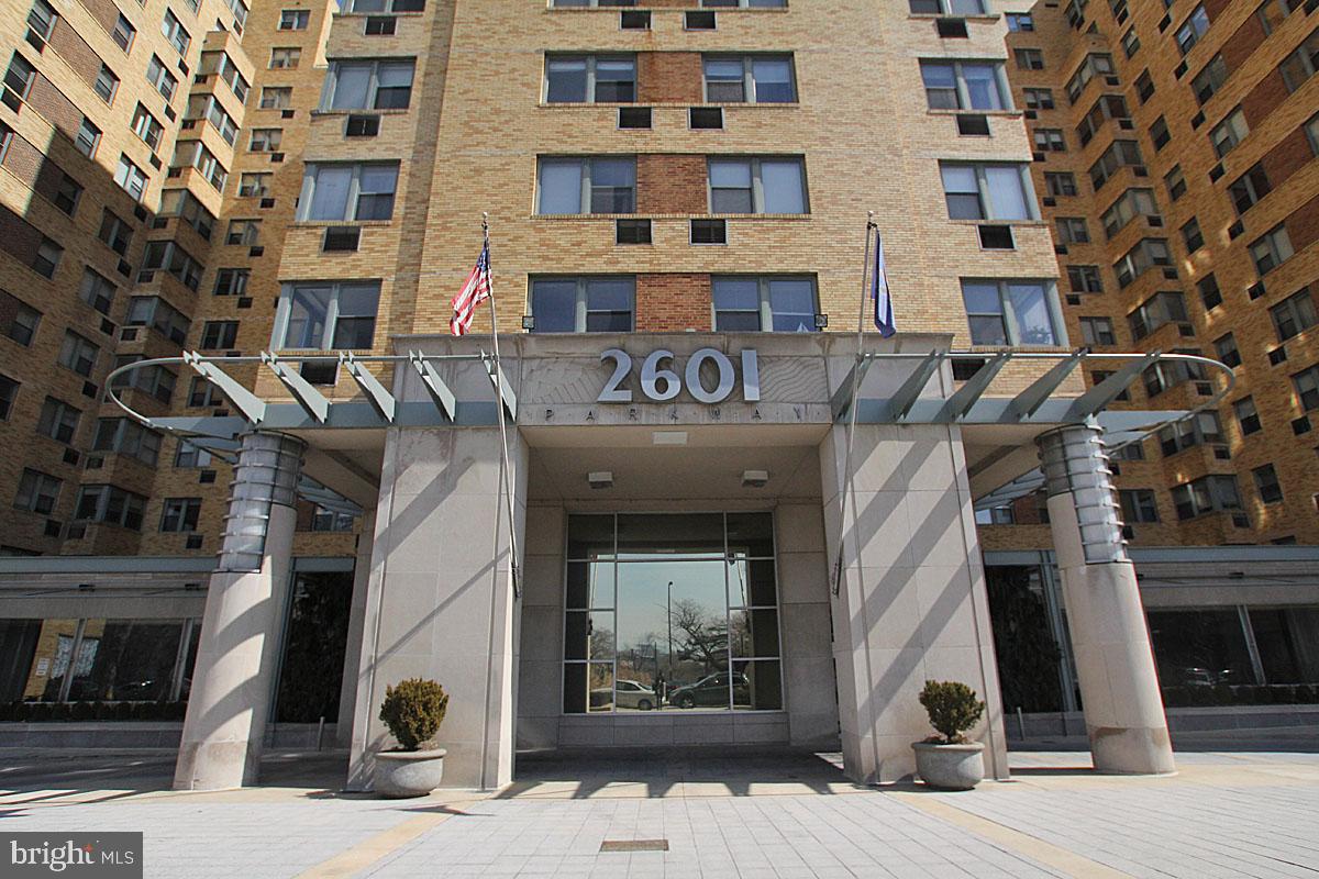 Spacious and pet-friendly, this light-filled 2-bedroom end unit in the beloved Fairmount neighborhood is sure to please! Be a part of history living in 2601 Parkway. The Art Deco building was designed by Paul Philippe Cret, who is considered one of the most influential architects of the first half of the twentieth century. His buildings and landmarks contribute to Philadelphia's essential character, including the Benjamin Franklin Bridge and the Rodin Museum. This unit offers over-sized living and dining areas with wood floors, coat closet, built-in bookshelves, and expansive windows. Each bedroom is roomy with great natural light and features double door closets. The kitchen has a gas stove and plenty of storage for all of your cookware. The bathroom has ceramic tile flooring, chrome fixtures, linen closet, and a vanity with storage. You'll love the convenience of the in-unit washer and dryer tucked neatly in a laundry closet that offers additional storage. 2601 Parkway offers many amenities including a Center City shuttle service, large fitness center, 24-hour front desk concierge service, on-site bike storage room, convenience store, plus a community room with free wi-fi, play area, and a fully functional kitchen for events. Also available are storage lockers, laundry room, dry cleaning service, and hair salon on-site. Ideally located across from the Philadelphia Museum of Art and Fairmount Park, this beautiful unit is close to Kelly Drive, Boathouse Row, The Barnes Museum, Whole Foods Market, Target, wonderful restaurants, and convenient transportation. Welcome Home!