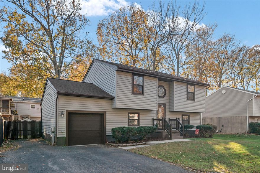 Welcome to Franklin Manor! This beautifully updated 4-bedroom, 2-bath home offers spacious living in a desirable water-oriented community. The main level features vaulted ceilings in the formal living room overlooking an open kitchen that leads directly to the rear deck and fully fenced yard. The walkout basement expands your living space with a large rec room, two additional bedrooms, and a full bath—ideal for guests or multi-generational living. Additional highlights include a 1-car garage and a roof replaced in 2018, along with other recent updates for peace of mind. Enjoy the Chesapeake Bay lifestyle with community amenities including two piers, a waterfront playground, gazebo, and picnic areas. This is your chance to experience coastal living in a charming neighborhood with endless outdoor enjoyment.