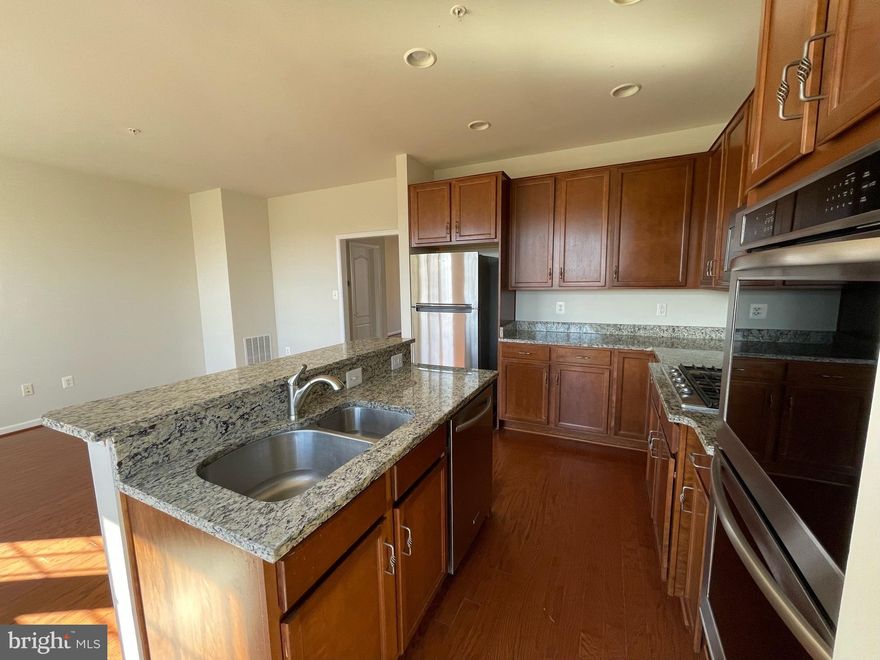 Location! Location! Location! Walking distance from Morgan Blvd Metro Station and FedEx Field with easy access to the city. Continently nearby Costco, BJ, Wegmans and many more restaurants and stores . Situated in a well-maintained community. State of the art Gym with a community pool.  2 car garage with a bid drive way that can fit two other cars in addition to 3 parking tags. Elegant Open concept layout making the main level spacious. . The living room has lot of natural light filtering through large windows, creating a warm and welcoming atmosphere. The gourmet kitchen is a true highlight, featuring granite countertops, stainless steel appliances, and ample cabinet space. A breakfast bar provides a casual dining option, while the adjacent dining area is perfect for more formal gatherings. Upstairs, the luxurious primary bedroom suite awaits, boasting a generous layout, plush carpeting, and a walk-in closet. The en-suite bathroom exudes sophistication with its dual vanity, spa-like bathtub, and a separate glass-enclosed shower. Two additional well-appointed bedrooms with ample closet space share a stylishly designed full bathroom on the same level. For added convenience, a laundry area is also located on this floor. The lower level has a large living space with a walk out to the backyard plus an additional bedroom. A half bathroom on this level adds to the convenience. . And for sports enthusiasts, the proximity to FedEx Field ensures you're just moments away from the excitement of game days and events.