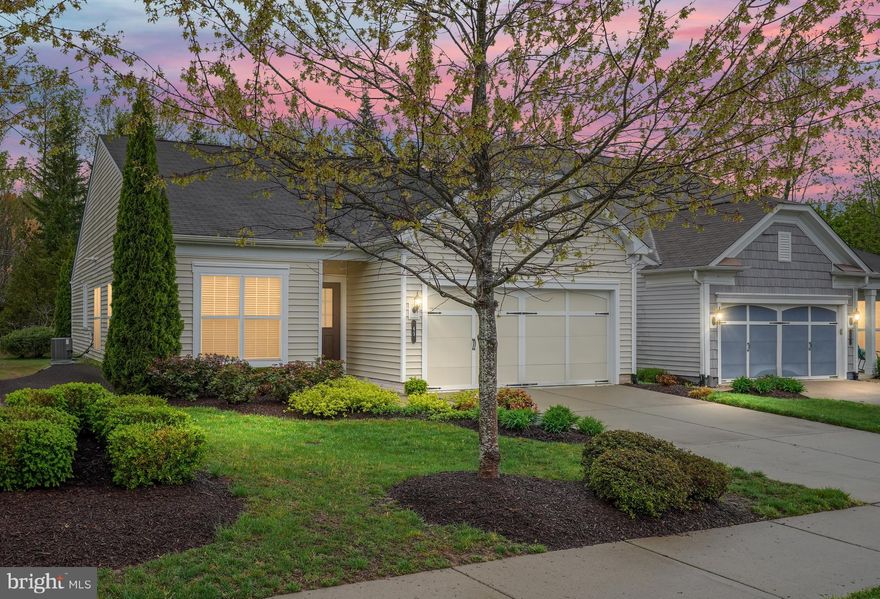 Welcome to 65 Denison St – Maintenance-Free Living in Celebrate Virginia North! Nestled in the heart of the highly sought-after Active Adult community of Celebrate Virginia North, this beautifully maintained 2-bedroom, 2-bathroom home offers 1,664 square feet of light-filled living space. Designed for both comfort and flexibility, this home features a traditional yet open floor plan that effortlessly adapts to your lifestyle needs. Step inside to find gorgeous wood flooring, elegant crown molding, and classic wainscoting that add a touch of sophistication. Just off the foyer, French doors open to a versatile flex space, ideal as a home office, cozy den, or even a third bedroom if desired. Entertaining is a delight in the formal dining and living rooms, where stately pillars define each space while maintaining an open and inviting feel. The well-appointed kitchen is the heart of the home, boasting a spacious peninsula with breakfast bar, offering additional seating, ample prep space, and extra storage. This space flows effortlessly into the family room, complete with a charming nook—perfect for a breakfast area or reading retreat. A wall of windows floods the living area with natural light and provides seamless access to the stamped concrete patio, where a private, tree-lined backyard creates the perfect setting for relaxation and outdoor enjoyment. The primary suite is a true retreat, offering peaceful rear-facing views, a large walk-in closet, and an en-suite bath featuring an easy-access shower. A second bedroom with Jack-and-Jill bath access ensures guests or family members feel right at home. Additional conveniences include a mudroom/laundry room with utility sink and direct access to the spacious 2-car garage. Living in Celebrate Virginia North means enjoying a resort-style lifestyle with full lawn maintenance and access to an impressive 30,000+ sq. ft. clubhouse featuring indoor and outdoor pools, a fitness center, billiards, pickleball and tennis courts, walking trails, putting greens, and a full-time lifestyle director to keep the social calendar full. Ideally located just minutes from shopping and dining, with a quick drive to historic Downtown Fredericksburg, this home offers the perfect blend of elegance, comfort, and convenience. Come experience the best of 55+ living—schedule your showing today!