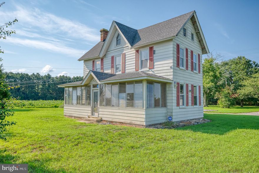 Charming turn-of-the-century Farmhouse on nearly four acres in Mardela Springs.  As you arrive, ample parking awaits just steps from the entrance to your forever home.  The enclosed front porch, with its louvered jalousie windows, invites you to enjoy the fresh country air.  Inside, the main floor boasts a spacious living room with a cozy wood-burning fireplace.  A large dining room, mudroom, half bath, and a convenient laundry area add to the home's practicality.  The eat-in kitchen, featuring ample cabinetry and counter space, is the heart of the home, complete with a rear staircase leading to the second floor.  Upstairs, you'll find three sizable secondary bedrooms, a generous primary bedroom, and a full bath, providing plenty of space for family and guests.  Step outside into your expansive backyard, where endless possibilities await. The property is adorned with mature shade trees, a fire pit area for gatherings, and wide-open green spaces for play and relaxation.  A detached two-car garage with ample storage, an additional outbuilding, and a barn further enhance the property's versatility.  This home offers a newer roof and windows, and a unique opportunity for new homeowners to add their personal touch.  All of this, plus the convenience of nearby shopping, dining, and commuter routes, makes this property an exceptional find.