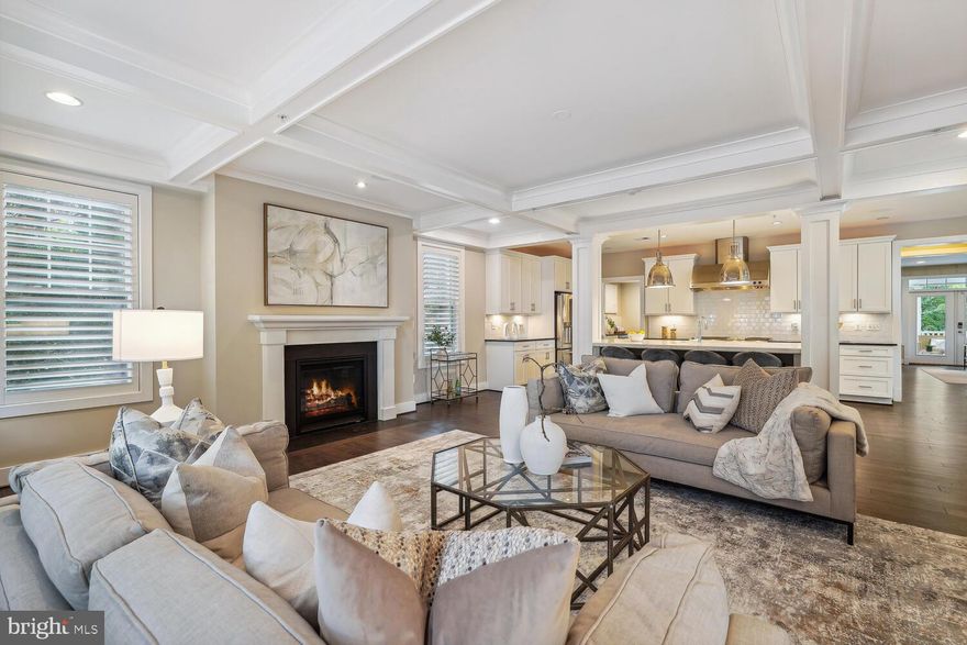 Prepare to be WOWED!  4806 Hutchins received an architectural design award from Luxury Homes and it was well earned.  Style, sophistication and classic design touches were combined to create a home that blends comfortable family living and gracious entertaining spaces.  Located in the Palisades, just blocks from the weekly Farmer's market, award winning restaurants and neighborhood parks and trails, 4806 Hutchins is sure to please even the most discerning buyers.

The first floor features a spacious family room and adjoining gourmet kitchen with a breakfast bar on the island with a marble waterfall countertop; stainless steel appliances include a 6-burner gas stove with griddle and double oven, built-in microwave, and Bosch dishwasher.  The family room has a coffered ceiling, gas fireplace and mounted tv with natural light streaming in from windows on three sides.  A perfect setting for relaxing with family and friends.  A butler's pantry located off the kitchen provides additional space for food prep and storage with an additional Bosch dishwasher, beverage refrigerator, sink, built-in desk and cabinets.
Between the family room and formal rooms is a wine room with 2 EuroCave 100-bottle wine refrigerators and custom cabinets.  The half bath has been updated with Jonathan Adler wallpaper and custom lighting adding style to the room.

The living room and dining room span the entire width of the house providing great flow for entertaining.  The living room features Phillip Jeffries 'Rivots' wallpaper adding an element of elegance and style to the space.  The dining room is large enough for large-scale entertaining as well as intimate gatherings.  Both rooms lead to the porch with an outdoor kitchen, perfect for alfresco dining as well as a seating/conversation area.  The kitchen features a VIKING built-in gas grill with a warming drawer, sink, trash cabinet and storage cabinet.  - a perfect setting for outdoor entertaining with two ceiling fans and three skylights as well as privacy curtains. A few steps down leads to a stone patio with a sunken hot tub .  The low maintenance yard features some landscaped beds framed by stone retaining walls and an irrigation sprinkler system.

The highlight of the second floor is the primary suite complete with a generously sized bedroom with custom roman shades, mounted tv , adjoining office, extra large walk-in closet and bathroom with marble floors, double vanity and separate water closet.  The bedroom is flooded with natural sunlight.  There are three additional bedrooms and two bathrooms on this level, each bedroom with custom blinds and window treatments and generous closets with ELFA closet systems.  The laundry room features front loading washer and dryer and cabinets with a sink.  Two linen closets on this level provide plenty of space for bedding, towels and linens.  This level is flooded with natural light from the wall of windows in the stairway giving all rooms a bright and airy feel.

Downstairs, the lower level offers additional space for play, with a large open room featuring a gas fireplace and mounted TV—perfect for crafts, games, or relaxation. A gym or fifth bedroom, with an attached full bath and closet, awaits, alongside a wet bar with custom cabinets and a beverage refrigerator. A mudroom with storage cubbies and coat hooks leads to the two-car garage, outfitted with custom flooring and storage systems for organization.
Additional features abound, including two HVAC systems, custom plantation shutters throughout, a security system, speaker system throughout the first floor, basement, and primary suite, and a whole-house fire sprinkler system.