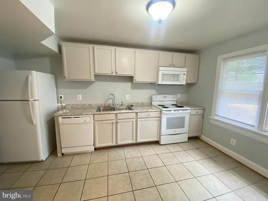 Spacious 2 level Townhome Condo.  Bright and Airy living room with recess lights.  Large kitchen with granite counterstops and table space.  3 bedrooms and full bath on upper level.  Extra storage space off kitchen and a full size wash and dryer in laundry room. Walk out to fenced backyard.  Ready to move-in! One assign parking space and one extra permit parking tag.  Sorry no pet and no smoker.