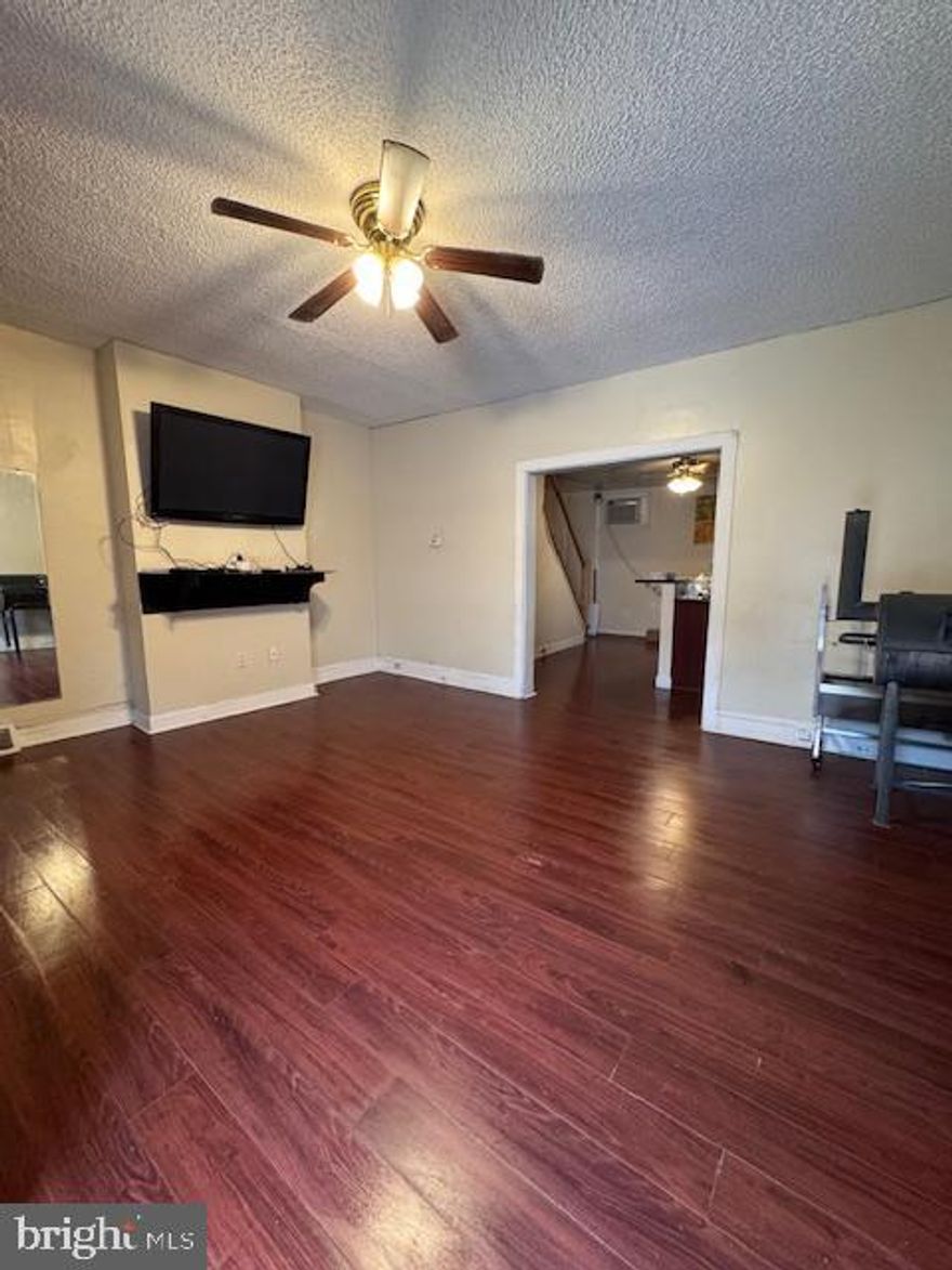 Welcome to 1328 N. Marston St., located in the highly sought-after Brewerytown section of Philadelphia. This property presents an excellent opportunity for an investor or a buyer utilizing a renovation loan who wants to create value while living in a vibrant and rapidly growing neighborhood. The main home features three bedrooms and one full bathroom, with a spacious living room that flows into an eat-in kitchen. Just beyond the kitchen, you’ll find a private outdoor courtyard—perfect for entertaining, relaxing, or enjoying outdoor gatherings. Across the courtyard sits a separate in-law suite offering approximately 900 square feet of additional living space. This structure has already undergone partial renovation, including new electrical and roughed-in plumbing, and is ready for completion. Once finished, the space is designed to include a half bathroom on the first level and a full bathroom on the second floor, making it ideal for extended family, guests, or additional rental potential. With strong bones, flexible living space, and endless possibilities, this property is a rare opportunity to customize a home in one of Philadelphia’s most desirable neighborhoods. This is an as-is sale.