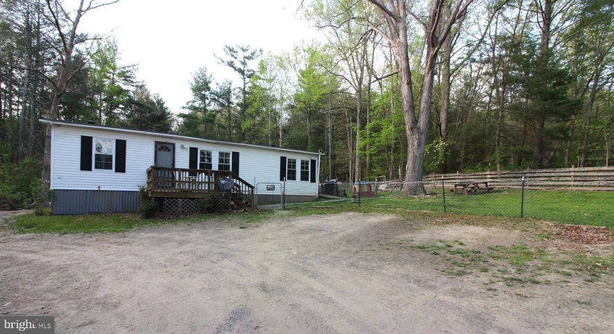 ** DUE TO RECIEVING MULTIPLE OFFERS, THERE IS AN OFFER DEADLINE.  PLEASE SUBMIT YOUR BEST HIGHEST OFFER BY THURSDAY APRIL 27 2023, AT 12 NOON. SELLER WILL SELECT AN OFFER BY 5 PM ON THURSDAY APRIL 27 2023 . THANK YOU.**
Are You looking for a place to unwind? How does Fresh air and Mountain Breezes sound? How about being able to  stick your toes in the nearby cool mountain stream on a hot humid day? Then  check out this Adorable and Affordable home in the country! If you would love to live just steps from unspoiled forestland, then this place is for YOU!! Property is located within easy walking distance of the National Forest at Laurel Run with its  Beautiful Walking/ Hiking/ Equestrian Trails, Public Hunting land and all of the Ammenities that the Mountains have to offer.
The  Ranch style Home sits back off of the road for privacy, and  offers single level living with 3 bedrooms and two baths. Many upgrades including wood laminate flooring,  Updated energy efficient tilt windows throughout, a New Furnace in 2014, a New Roof in 2019, Septic and Septic lines pumped and serviced in 2022,  Well pump replaced in 2023.
 Nice level and spacious front yard.  Adorable outbuilding that would make the perfect tiny house or childs playhouse . Deck provides a nice area for cookouts/gatherings. A great place to call home, grow vegetables in your own garden and so much more! Make your appointment to see it today! This one will not last long!!
 Please do not tresspass on property without an appointment. Dogs on premises  are protective.