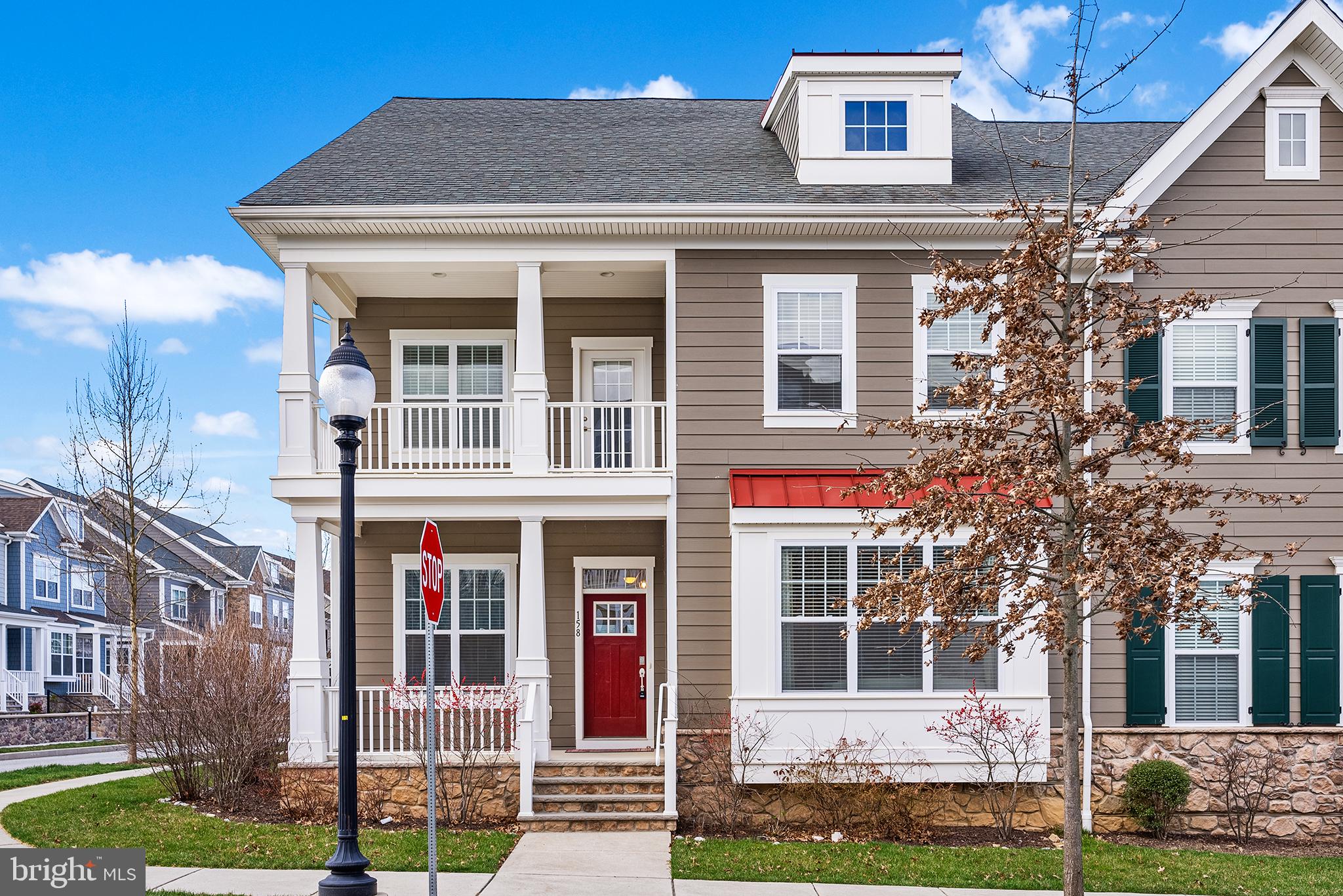 No need to wait for new construction; this meticulously maintained Spring Oak carriage home is
available now! This home boasts the popular Bonhill layout, which is no longer offered in the
community, with upgrades in every room and soft-close cabinets throughout. This 4 bedroom, 3.5
bath beauty proudly sits on a premium corner lot just blocks away from the community pool and
playground. A covered front porch invites you into the home’s entry, where you are pleasantly greeted
by 10’ ceilings, with upgraded tray ceiling, and an Amish-built custom drop zone to store all your day-to-day items. You are also greeted by a delightful open floor plan with the star being the gorgeous
kitchen with large island, Quartz countertops, solid wood cabinetry with soft-close
doors/drawers, stainless steel appliances, an oversized pantry with solid Amish built custom
cabinetry and an adjacent breakfast room. The kitchen is open to the dining room which has a bump-out
window seat, and the living room complete with an upgraded gas fireplace, carpet inlay and 12’ tray ceiling. The laundry room is conveniently located right inside the back door, which leads out to a composite deck with lighting and oversized 2-car garage. The main level also features a primary bedroom with an upgraded bump out, tray ceiling and TWO walk-in closets. The primary ensuite bath has upgraded cabinetry, a large walk-in rain shower and a water closet. The main level is complete with a powder room and large office with Amish-made custom cabinetry, desk and workstations. Upstairs you will find a large loft with built-in bookshelves and speakers, perfect for a den, playroom or library. Three more bedrooms
are located on this level, one with an ensuite full bathroom and walk-in closet and one with a lovely
balcony for additional space to enjoy the outdoors. A hall bathroom with dual sinks completes the upper
level. The partially finished basement has a rough-in for a full bathroom and a second egress - it is just
waiting for your finishing touches to add even more living space to this gorgeous home. A perfect
space for a 5th bedroom, game/movie room or for whatever fits your needs. Additional knock-out
features include a tankless hot water heater, dual zone HVAC, a whole house humidifier, an air filtration system, new 2" blinds on most windows, and lighted ceiling fans in all bedrooms, the office, loft and family room. You will enjoy the many amenities this community offers including a clubhouse, fitness center,
swimming pool, playgrounds, community garden and walking trails.